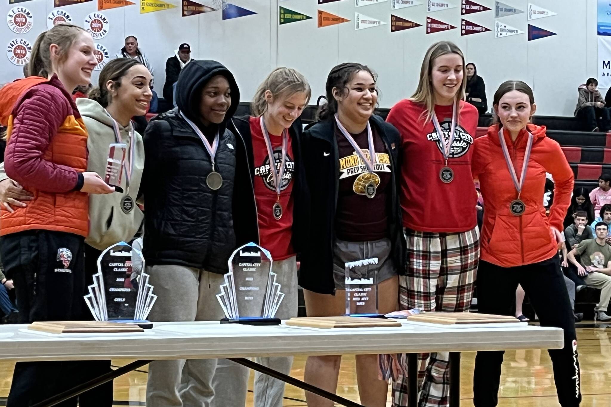 JDHS players Skylar Tuckwood, Mila Hargrave and Gwen Nizich each earned all-tournament honors for the Crimson Bears during the Capital City Classic awards ceremony. (Jonson Kuhn / Juneau Empire)