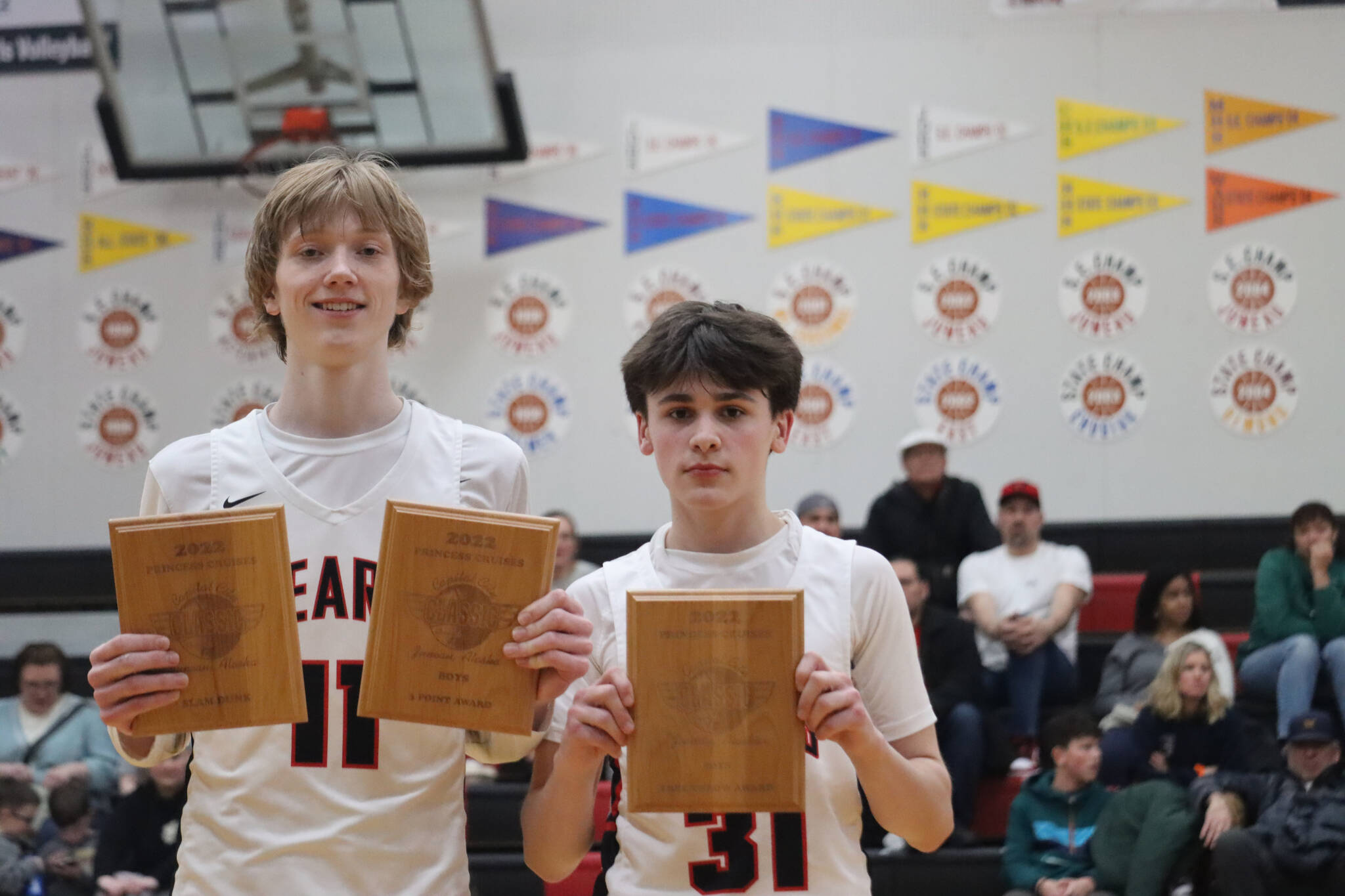 JDHS junior Sean Oliver and freshman Brandon Casperson each took honors during the Capital City Classic awards ceremony. Oliver won for both 3-point shooting and the dunk contest while Casperson won for the boys free throw contest. (Jonson Kuhn / Juneau Empire)