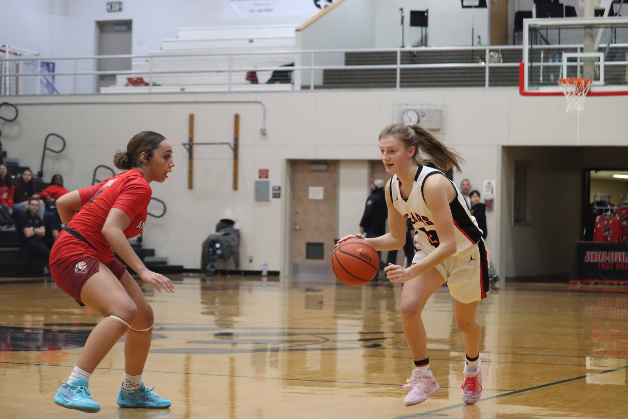 JDHS senior guard Skylar Tuckwood takes the ball down court on Friday against Anchorage Christian School. Tuckwood led the Crimson Bears in scores with 23 points in total. (Jonson Kuhn / Juneau Empire)