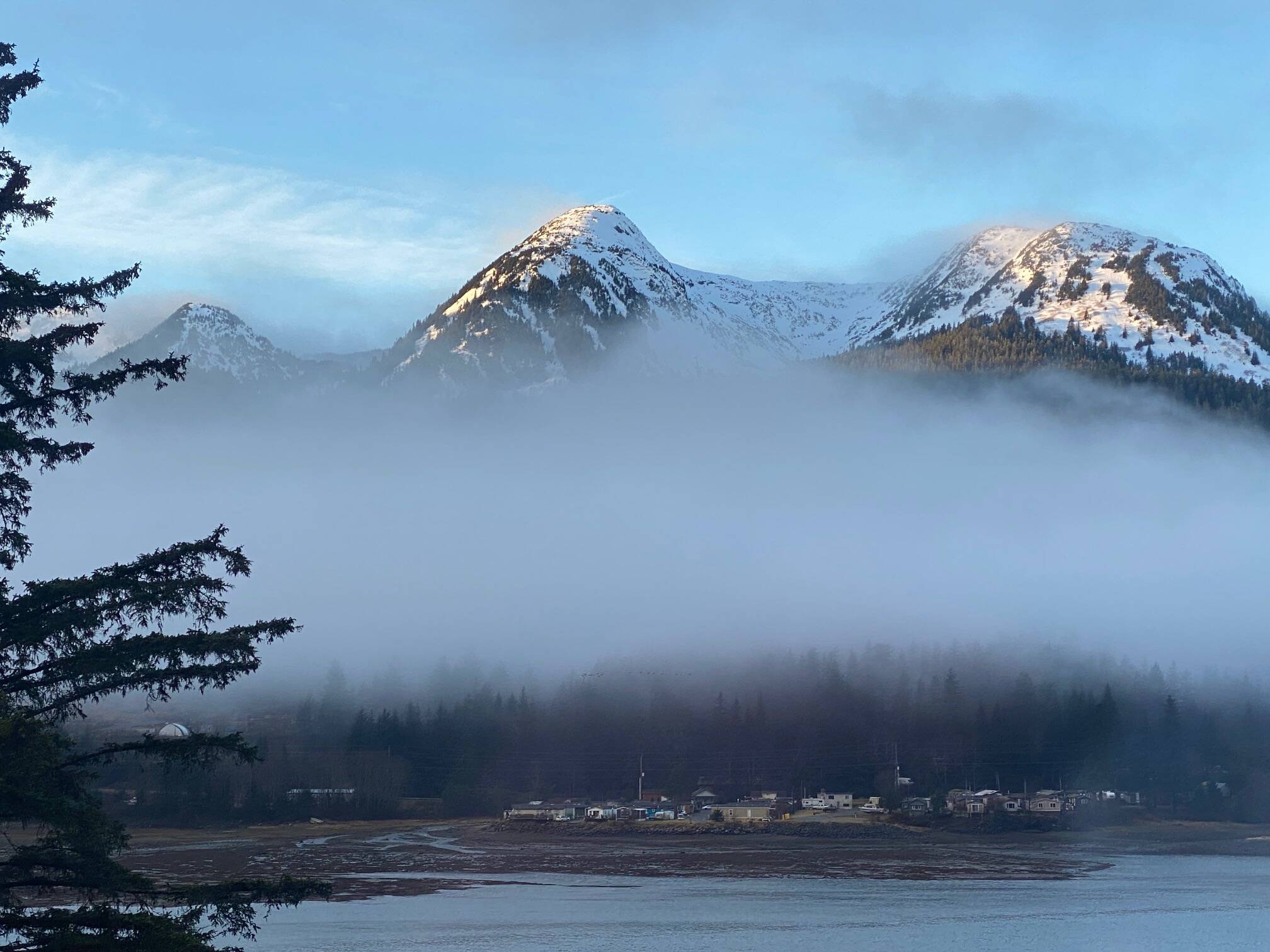 Morning sunshine causes fog along the Douglas Range to dissipate. (Courtesy Photo / Denise Carroll)