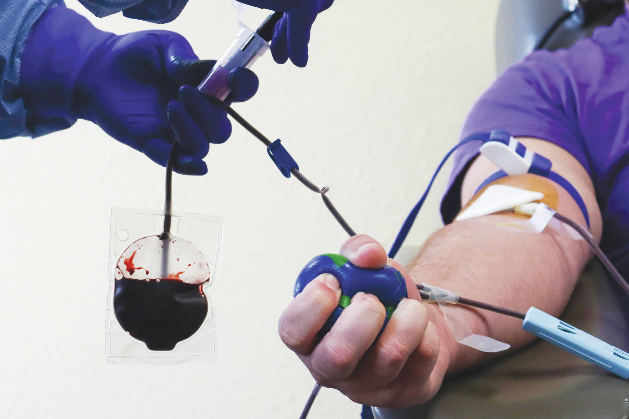 A donor gives blood at the Blood Bank of Alaska’s Juneau center. The BBA recently issued a news release asking for donations to coincide with National Blood Donor Month.(Ben Hohenstatt / Juneau Empire File)