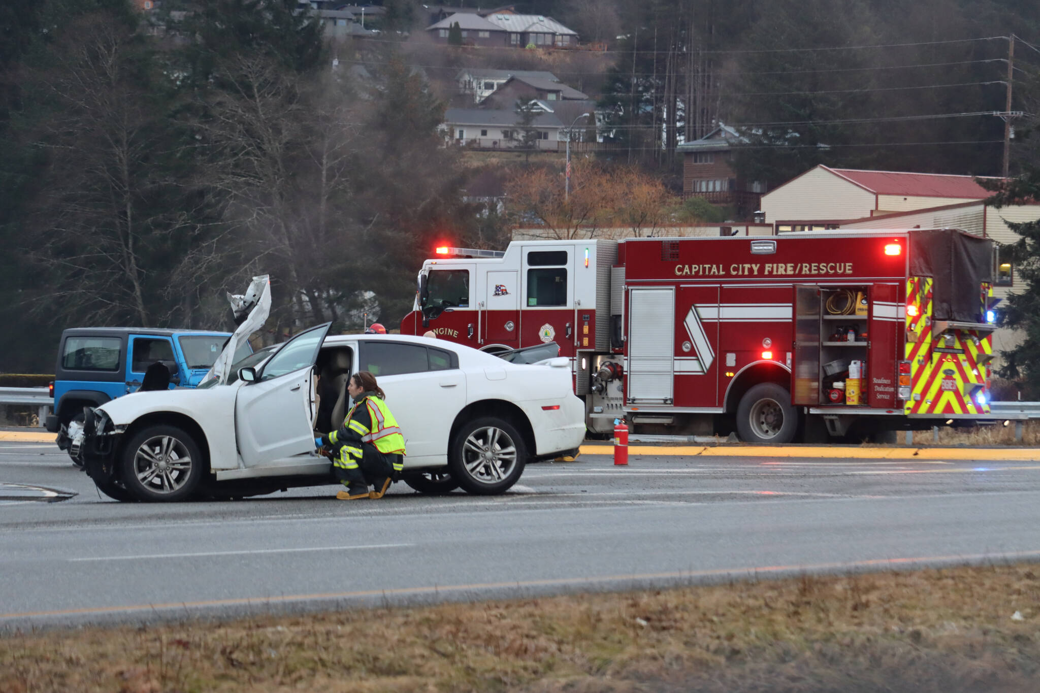 A 2014 white Dodge Challenger, seen here, was cited by JPD for failure to exercise due care which resulted in a three car crash on Thursday afternoon at the intersection of Vanderbilt and Egan Drive. (Jonson Kuhn / Juneau Empire)