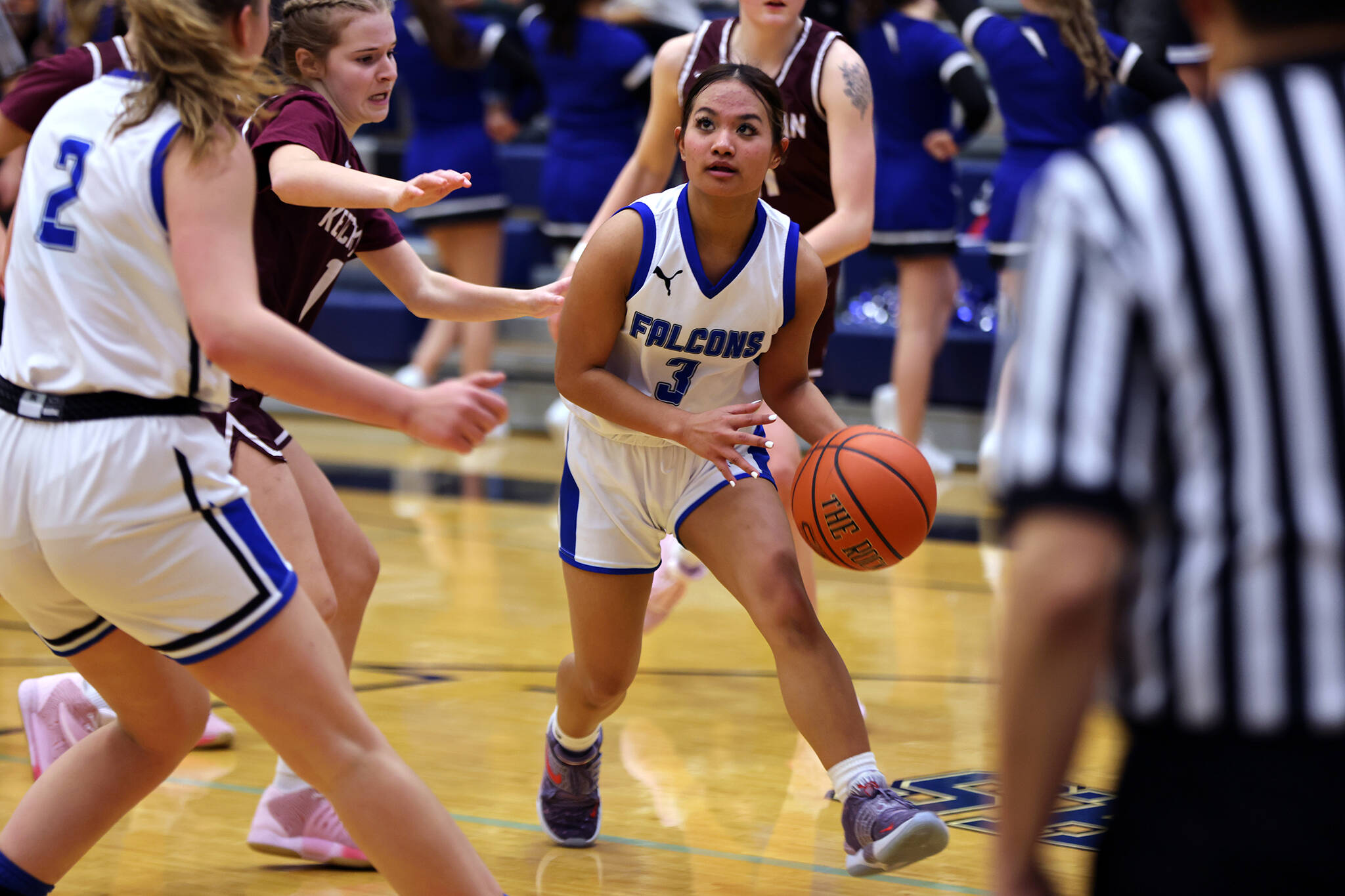 Junior Jaya Carandang looks to pass during a Friday night win against Ketchikan High School. Carandang finished the game with 9 points, including a buzzer-beating 3-pointer to send the Lady Falcons into halftime with a 9-point lead. (Ben Hohenstatt / Juneau Empire)