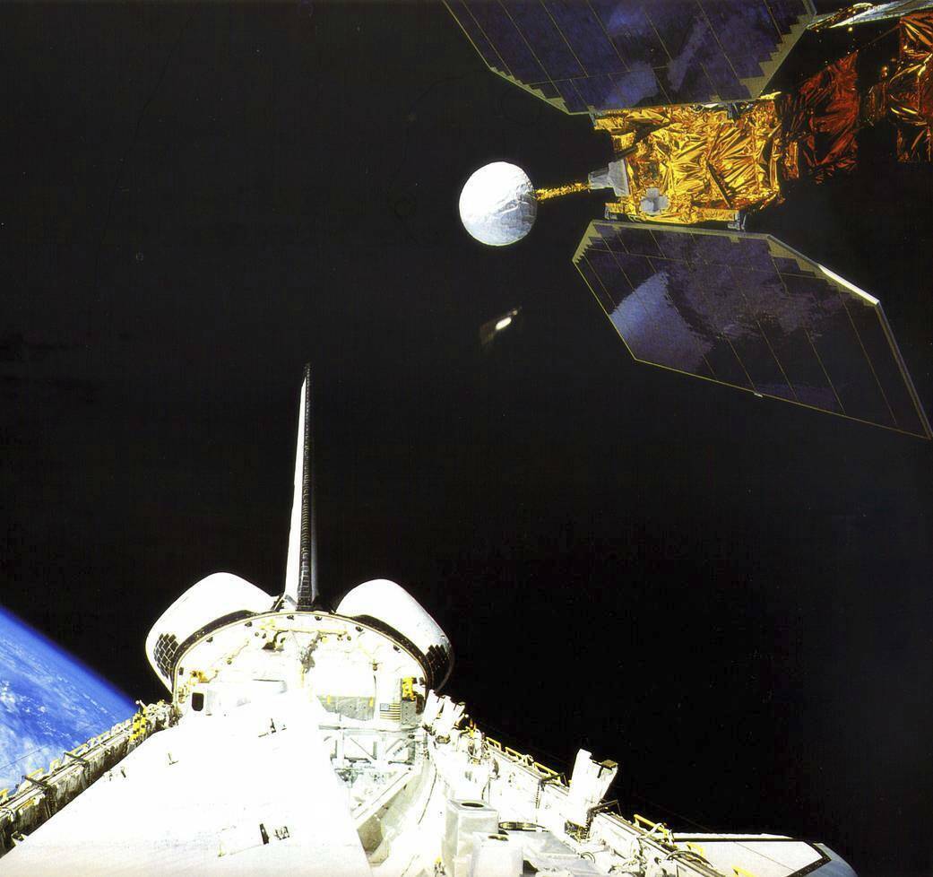 In this photo made available by NASA, the space shuttle Challenger launches the Earth Radiation Budget Satellite in 1984. On Friday, Jan. 6, 2023, the U.S. space agency said the 38-year-old NASA satellite is about to fall from the sky, but the chance of wreckage falling on anybody is “very low.” It’s expected to come down Sunday night, give or take 17 hours. (NASA)