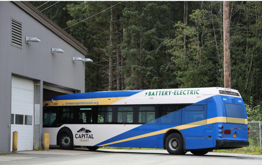 The only electric bus enters the City Borough of Juneau Capital Transit’s bus barn in late August. Capital Transit is preparing for the addition of seven electric buses which are slated to hit Juneau’s roads sometime in summer of 2024. (Clarise Larson / Juneau Empire File)