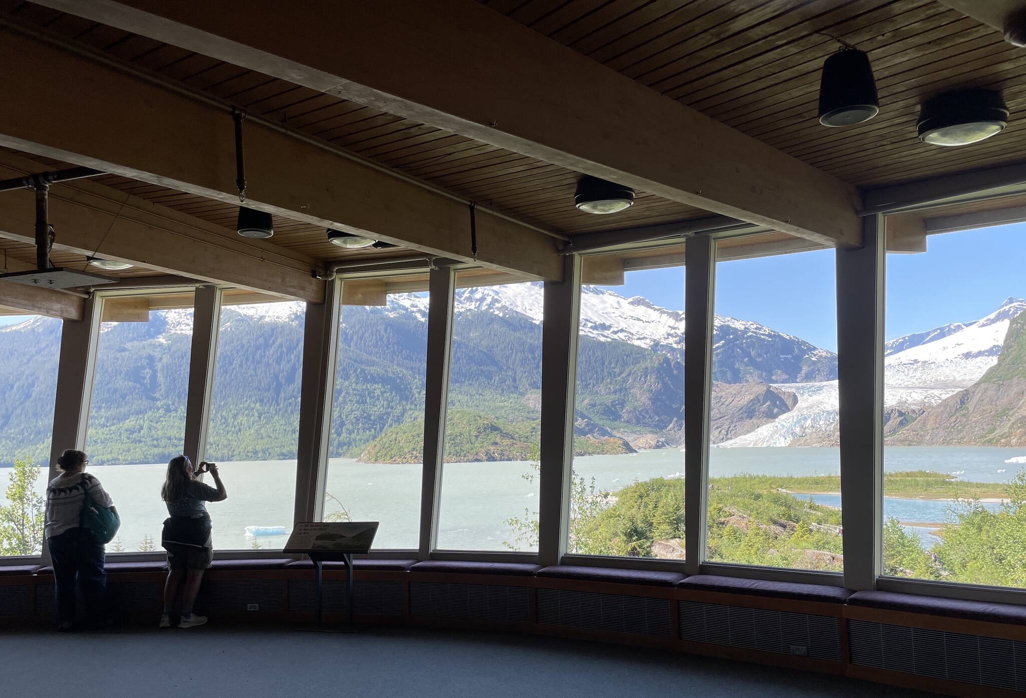Visitors take images of Mendenhall Glacier near Juneau in summer 2022 from inside the Mendenhall Glacier Visitor Center. (Courtesy Photo / Ned Rozell)
