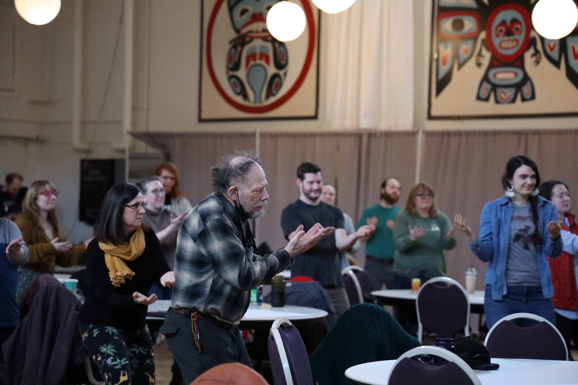 Attendees of the Alaska Music Summit on Saturday danced during the land acknowledgement and opening song performed at the Juneau Arts and Culture Center late Saturday morning. (Clarise Larson / Juneau Empire)