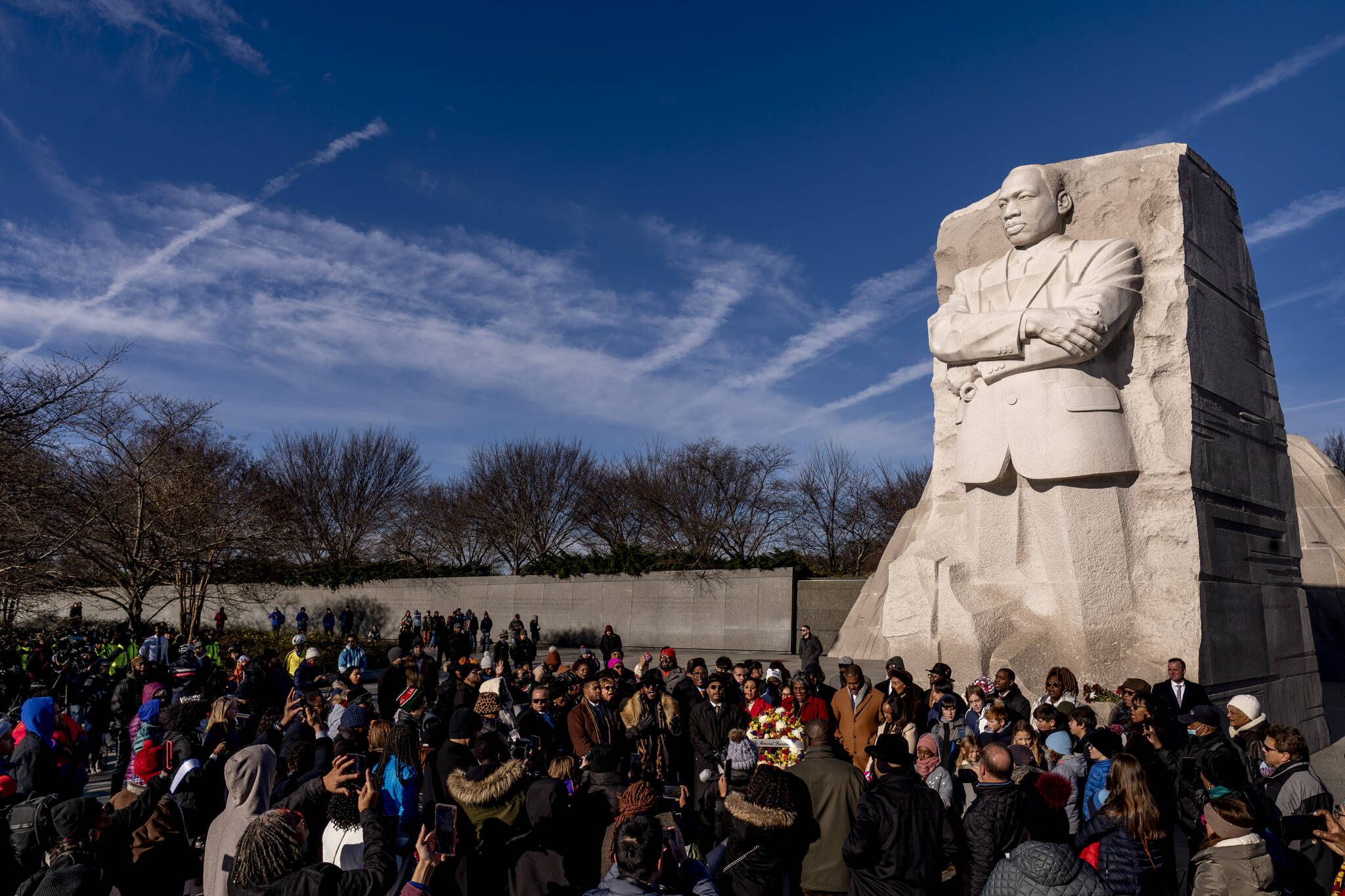 A large group gathers to watch a wreath-laying ceremony at the Martin Luther King Jr. Memorial on Martin Luther King Jr. Day in Washington, Monday, Jan. 16, 2023. (AP Photo / Andrew Harnik)