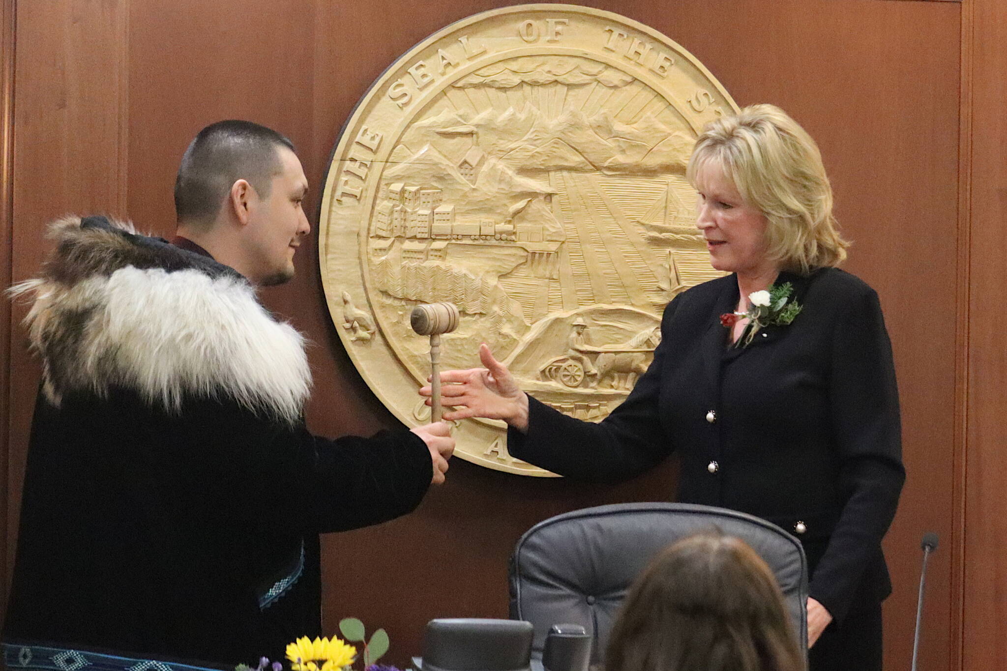 State Rep. Josiah Patkotak, I-Utqiaġvik, left, accepts the gavel from Lt. Gov. Nancy Dahlstrom after being elected speaker pro tem of the House during the opening day of the 33rd Alaska State Legislature on Tuesday. Patkotak, who has served as president pro tem during a previous stalemate in determining a House majority, is among the members Republicans are trying to lure to join a coalition controlled by their party. (Mark Sabbatini / Juneau Empire)