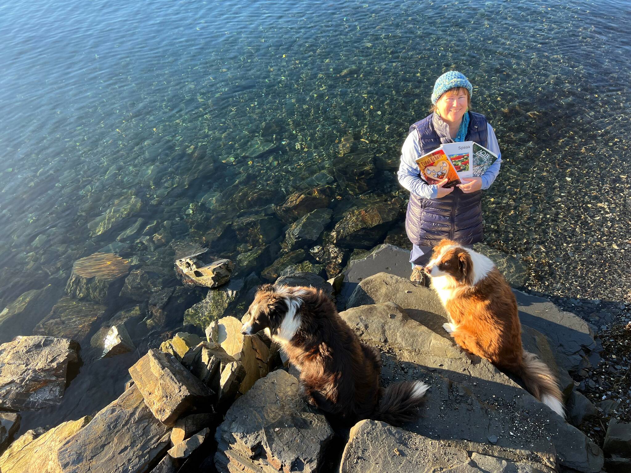 Vivian Faith Prescott, accompanied by dogs Kéet and Oscar, holds Alaska’s literary journals in Wrangell. (Courtesy Photo / Vivian Faith Prescott)