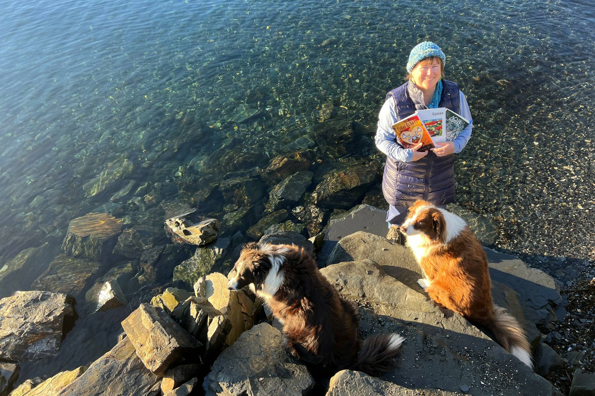 Vivian Faith Prescott, accompanied by dogs Kéet and Oscar, holds Alaska’s literary journals in Wrangell. (Courtesy Photo / Vivian Faith Prescott)