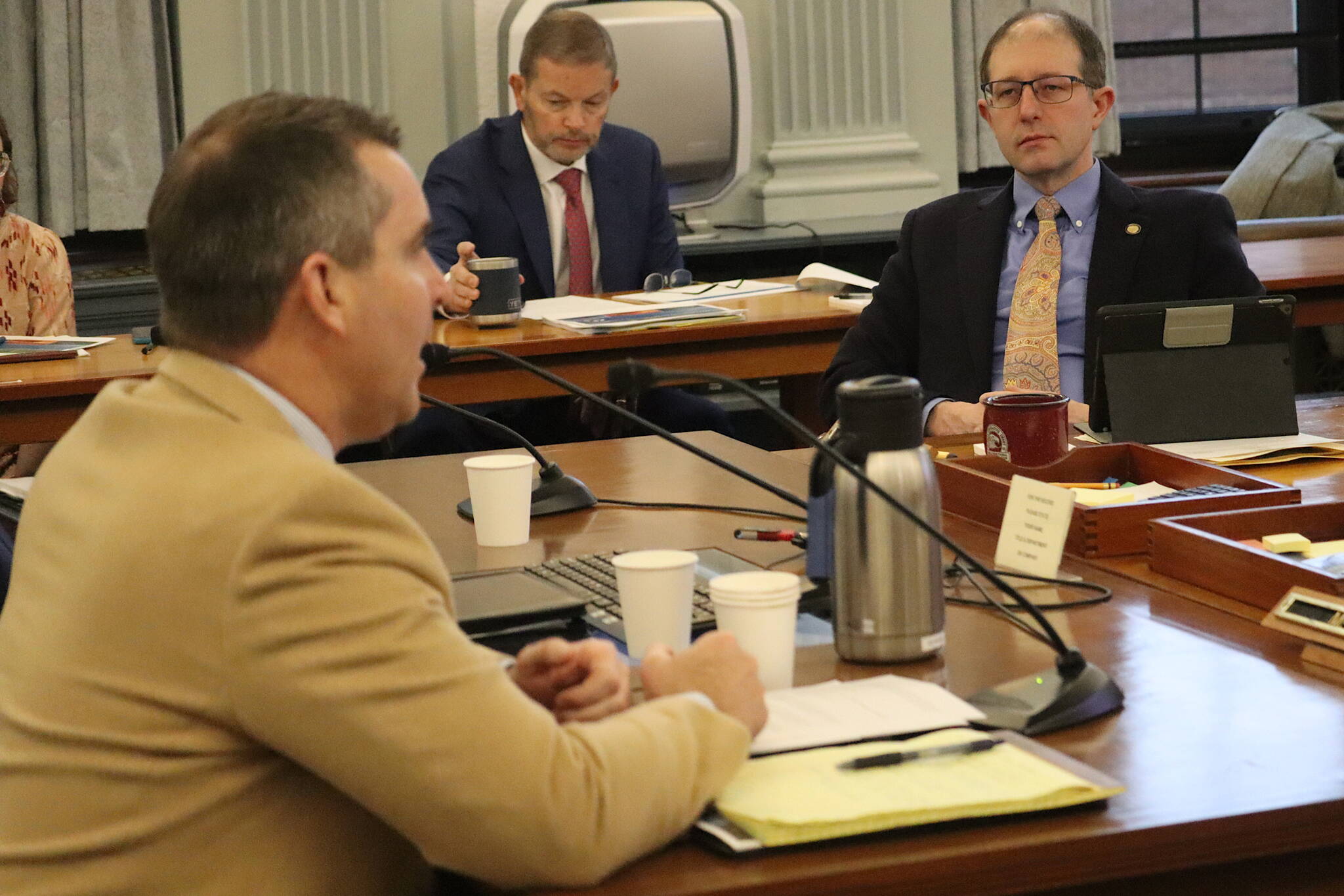 State Sen. Jesse Kiehl, D-Juneau, right, listens to an overview of Alaska’s past and projected oil production by Department of Natural Resources Commissioner John Boyle during Kiehl’s first meeting as a member of the Senate Finance Committee on Wednesday. (Mark Sabbatini / Juneau Empire)