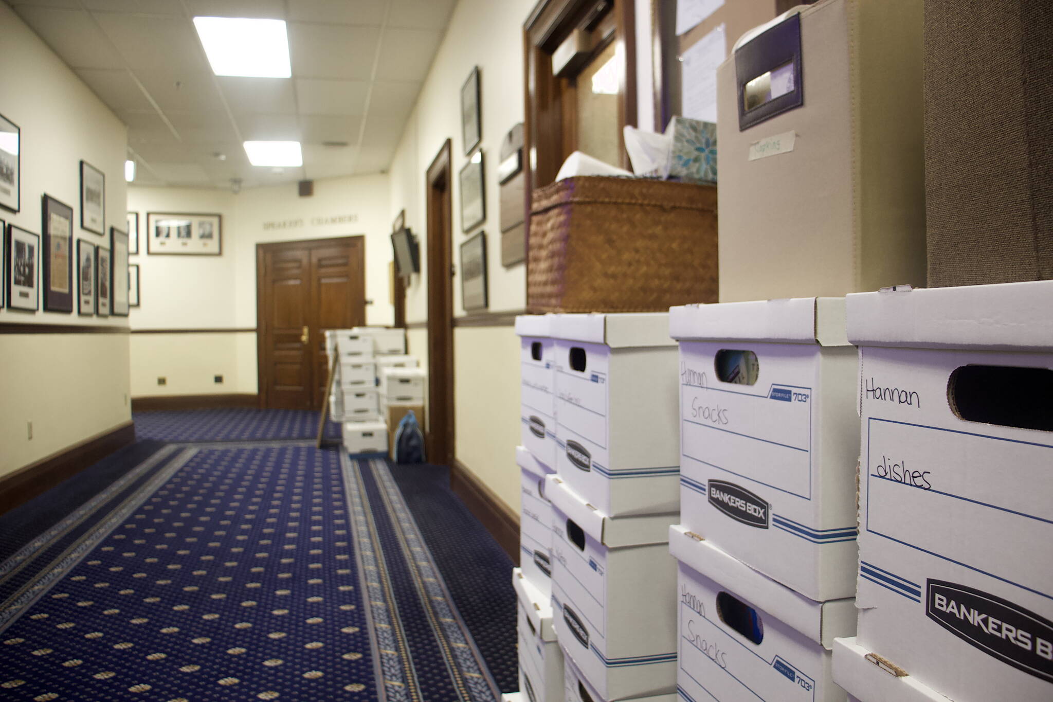 Moving boxes are stacked outside the offices of state Rep. Sara Hannan, D-Juneau, and former House Speaker Louise Stutes, a Kodiak Republican, on the second floor of the Alaska State Capitol on Wednesday morning following their demotion to minority status after a Republican-led majority excluding Stutes was named Tuesday. As minority members, they will have no official say on the location of their new offices. (Mark Sabbatini / Juneau Empire)