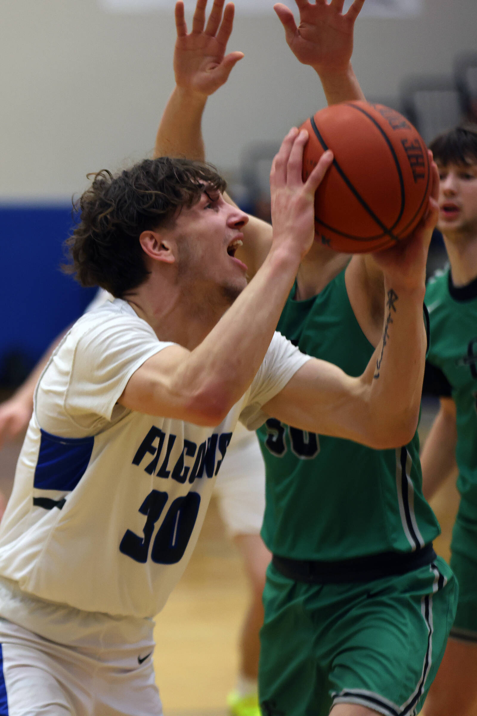 TMHS junior Thomas Baxter fights his way toward the hoop during a Thursday night home game against Colony. In Friday’s rematch, Baxter led all scorers with 27 points. (Ben Hohenstatt / Juneau Empire)