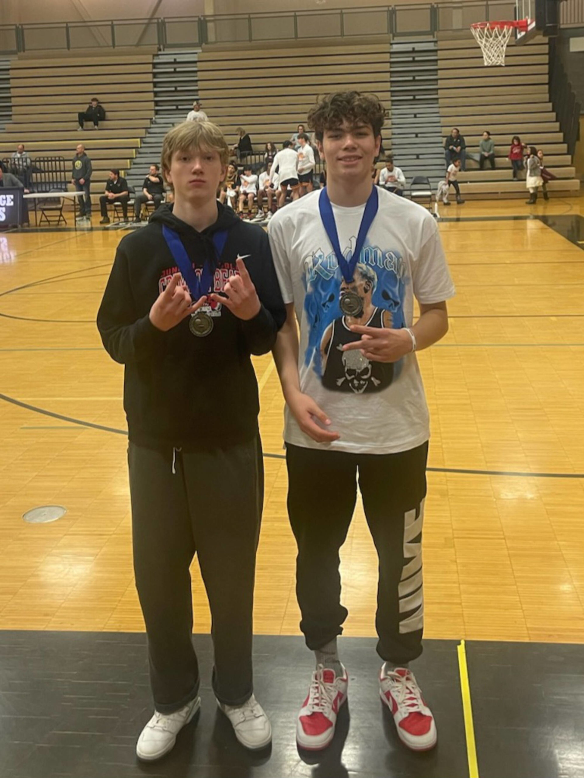 JDHS junior Sean Oliver and senior Orion Dybdahl pose for a photo on Saturday after earning all-tournament honors at the OBrady Invitational tournament in South Anchorage. (Courtesy Photo / Robert Casperson)