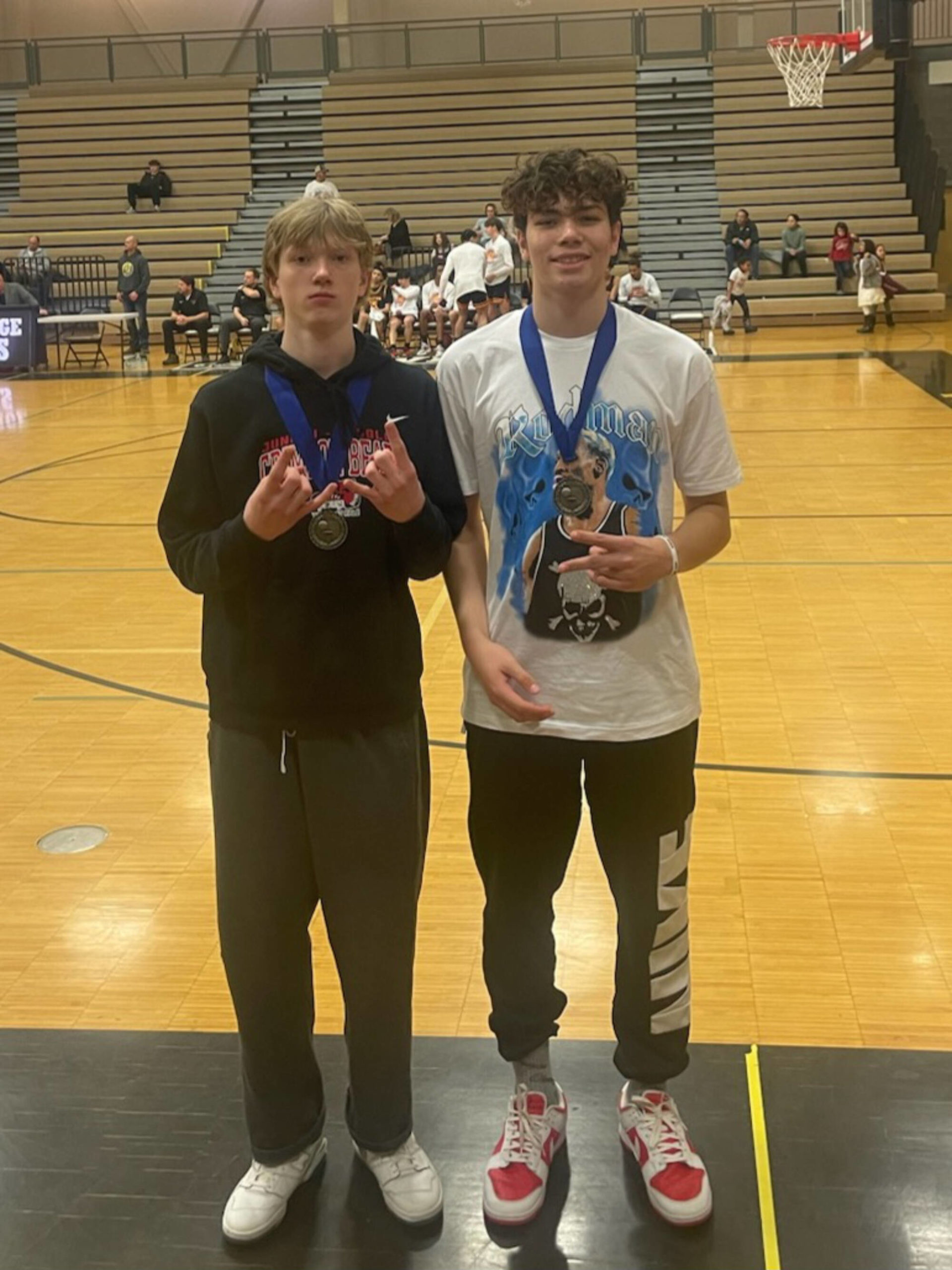 JDHS junior Sean Oliver and senior Orion Dybdahl pose for a photo on Saturday after earning all-tournament honors at the O’Brady Invitational tournament in South Anchorage. (Courtesy Photo / Robert Casperson)