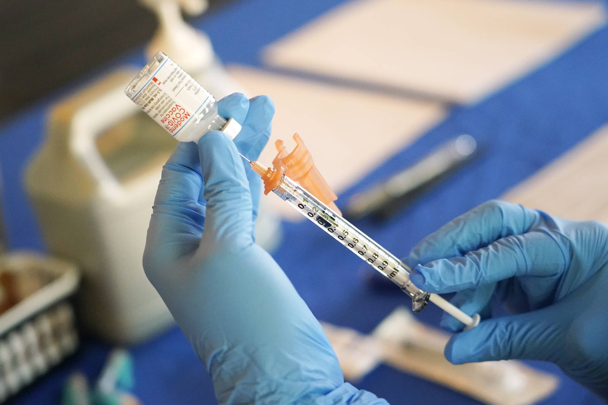 A nurse prepares a syringe of a COVID-19 vaccine at an inoculation station in Jackson, Miss., July 19, 2022. U.S. health officials are proposing a simplified approach to COVID-19 vaccinations, which would allow most adults and children to get a once-a-year shot to protect against the mutating virus. The new system unveiled Monday, Jan. 23, 2023 would make COVID-19 inoculations more like the annual flu shot. Americans would no longer have to keep track of how many shots they’ve received or how many months it’s been since their last booster. (AP Photo / Rogelio V. Solis)