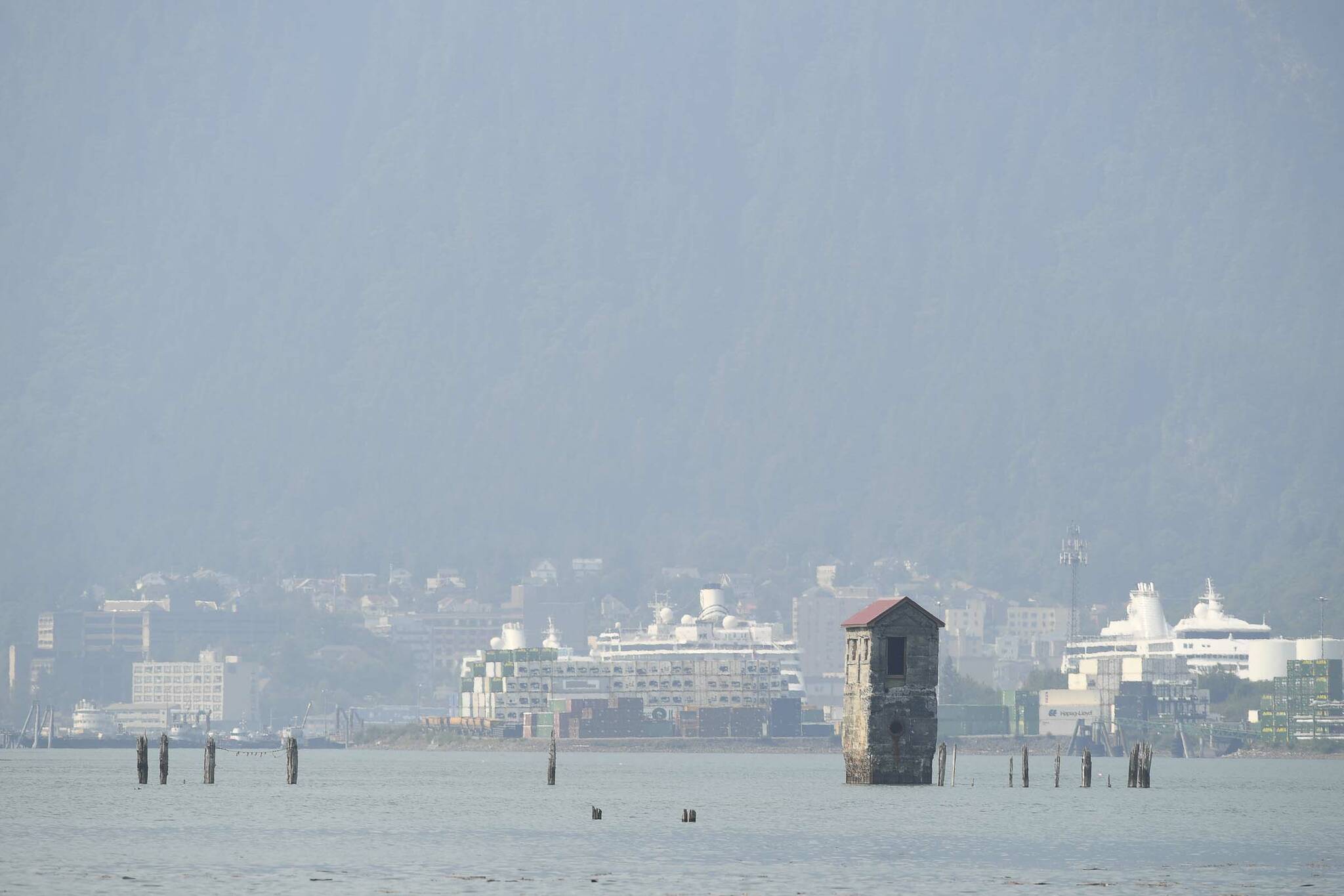 Smoke and haze fill the air to filter the view of downtown Juneau from Douglas Island on Friday, July 5, 2019. (Michael Penn | Juneau Empire)