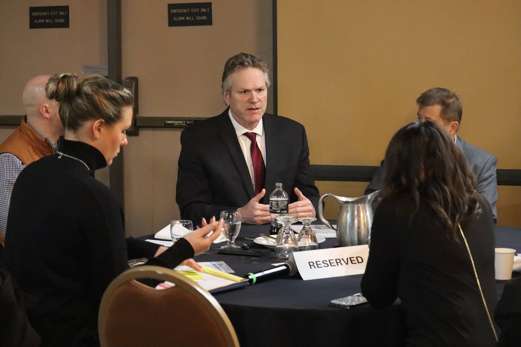 Gov. Mike Dunleavy talks about his second-term agenda with members of the Alaska Chamber of Commerce, which is doing a two-day legislative fly-in this week, before his speech during the Juneau Chamber’s weekly luncheon Thursday. The speech and subsequent question period was at the Baranof Hotel to accommodate the extra out-of-town guests spending much of their time at the Alaska State Capitol, rather than the usual location at the Juneau Moose Lodge Family Center. (Mark Sabbatini / Juneau Empire)
