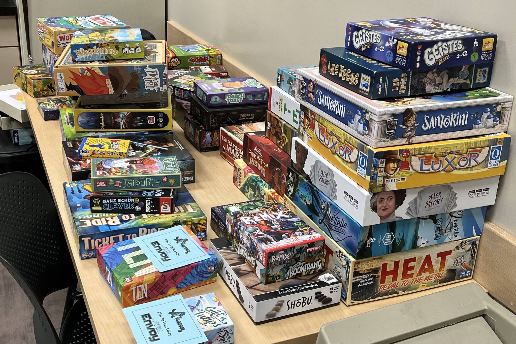 Juneau residents choose from a wide variety of games, seen here, on Saturday during Platypus Gamings mini-convention at Juneau Public Libraries over the weekend. (Jonson Kuhn / Juneau Empire)