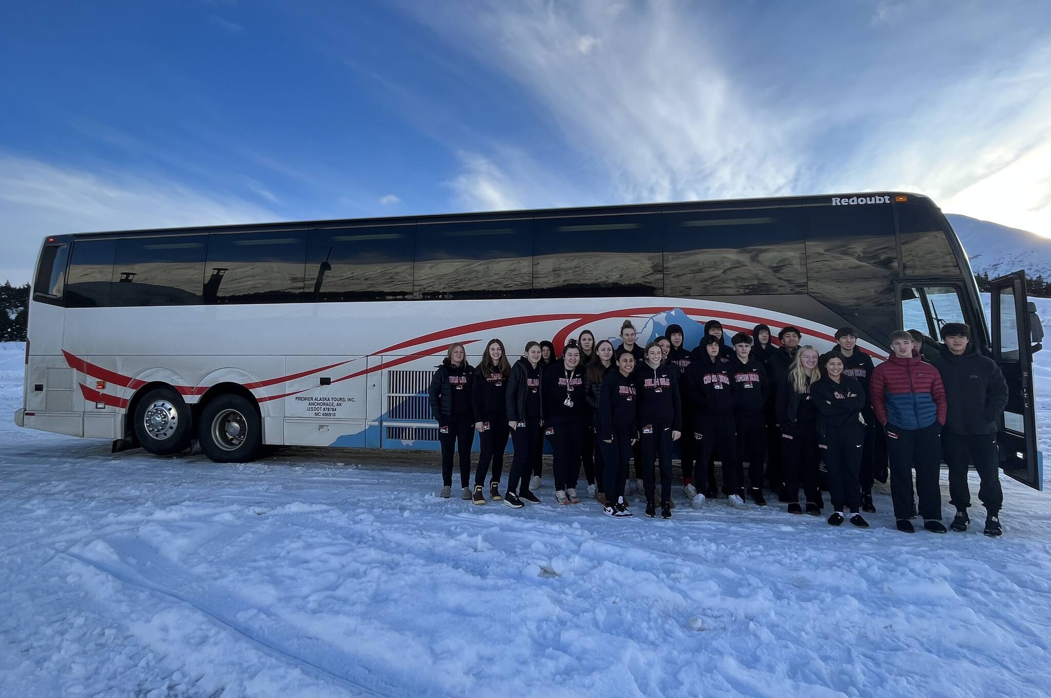 JDHS girls and boys basketball team pose for a photo outside after traveling to Soldotna for a 3-game tournament. (Courtesy Photo / Tanya Nizich)