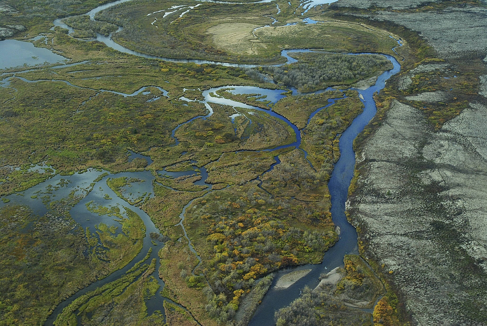 This September 2011 aerial photo provided by the Environmental Protection Agency, shows the Bristol Bay watershed in Alaska. The U.S. Environmental Protection Agency on Tuesday, Jan. 31, 2023, effectively vetoed a proposed copper and gold mine in the remote region of southwest Alaska that is coveted by mining interests but that also supports the world’s largest sockeye salmon fishery. (Joseph Ebersole / EPA)