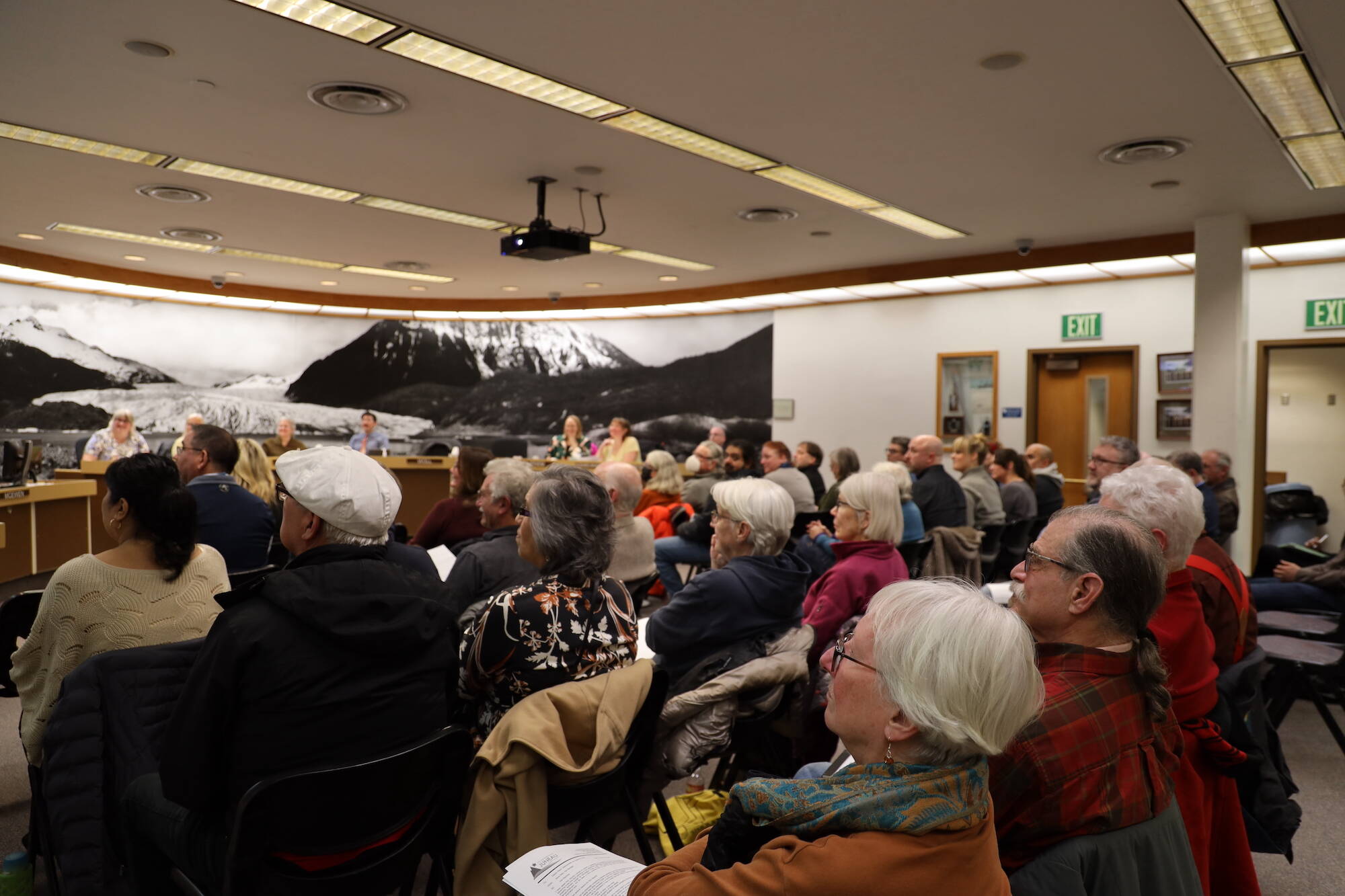 A large crowd listens to public testimony at Monday night's Assembly meeting about a resolution on whether the Assembly should formally adopt the 2020 Visitor Industry Task Force's cruise ship tourism policy recommendations. (Clarise Larson / Juneau Empire)