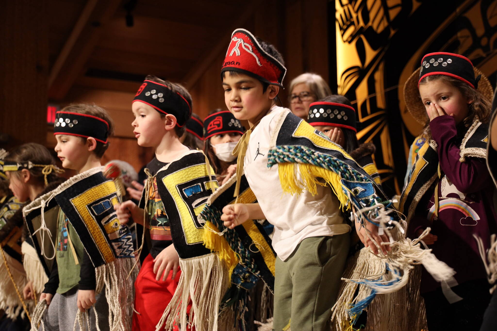 Clarise Larson / Juneau Empire
Young students from the Tlingit Culture Language and Literacy program at Harborview Elementary School dance on stage Wednesday afternoon during a dancing-of-the-robes ceremony for over a dozen Chilkat robes that were weaved by student weavers who participated in a more than two-year-long apprenticeship to learn the craft.