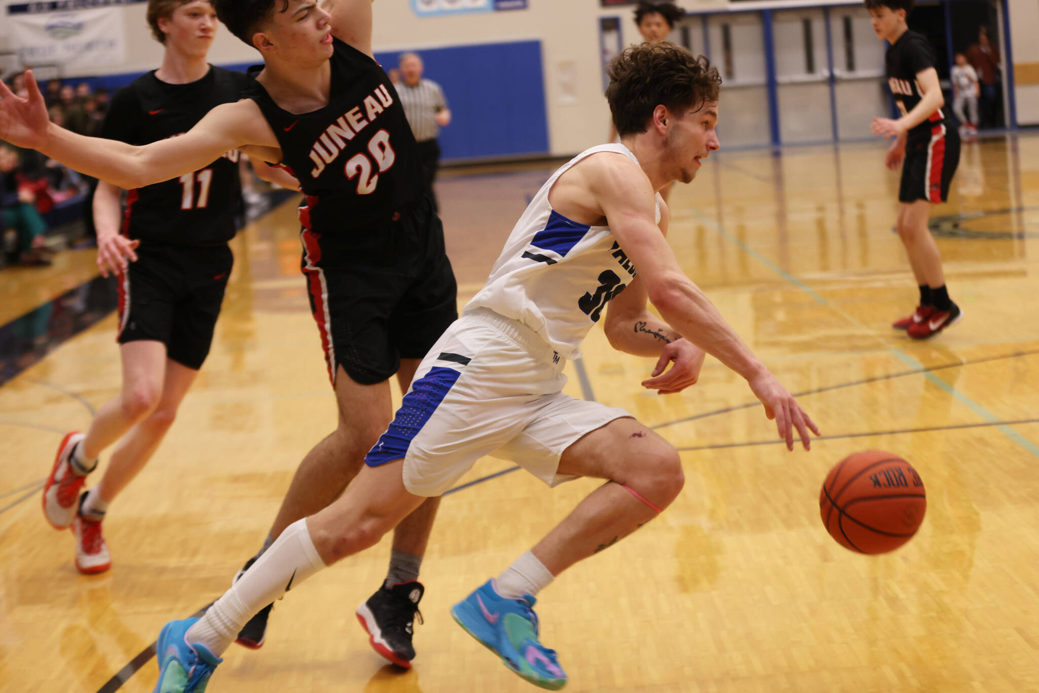 Ben Hohenstatt / Juneau Empire 
TMHS junior Thomas Baxter drives toward the hoop during a Thursday night home game against JDHS, Baxter led all scorers in the game with 18 points.