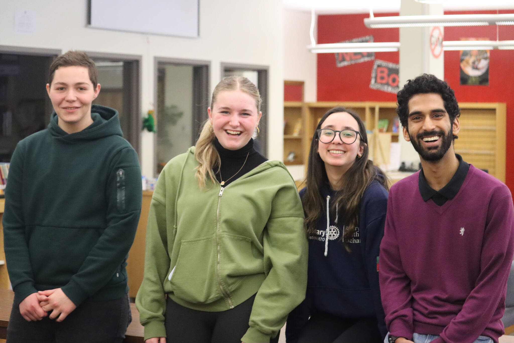 From left to right, AFS and Rotary exchange students Goce Dimitriev, Leni Schilling, Ana Scopel and Wasiq Malik pose for a photo at Floyd Dryden Middle School on Friday. Each met with various classes throughout the day to share their presentations and answer questions from Juneau students. (Jonson Kuhn / Juneau Empire)