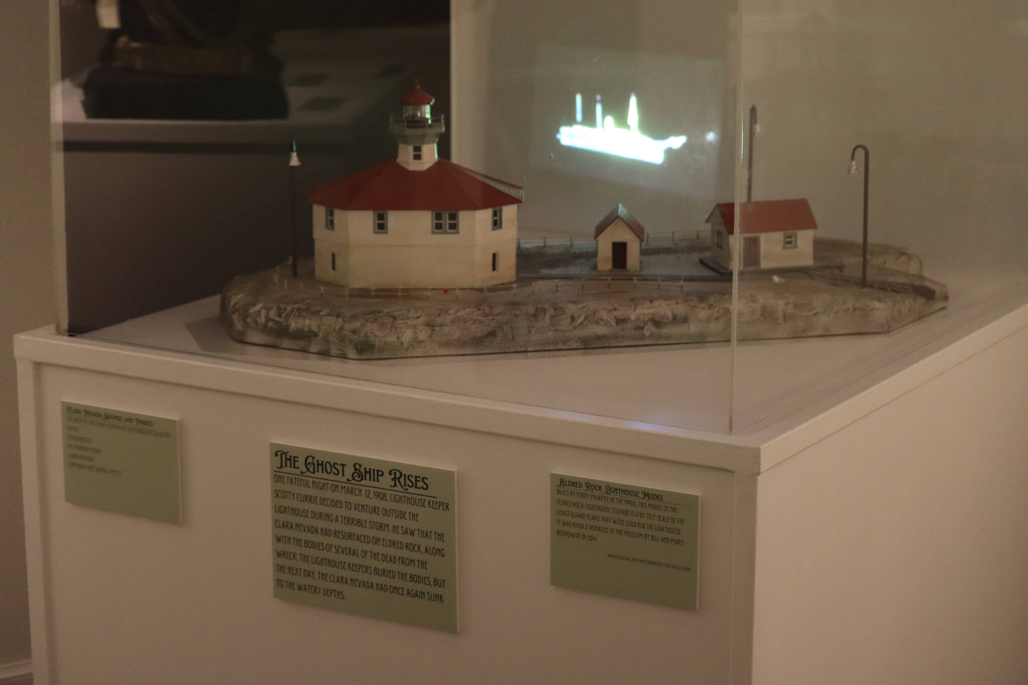 A model of the Eldred Rock Lighthouse with ghost ship effect helps tell the story of how the Clara Nevada was said to be spotted on shore along with passenger’s bodies by lighthouse assistant Scottie Currie in 1908 before mysteriously disappearing the following day. The display is part of the Haines Sheldon Museum’s current exhibit, “A Mystery Lies Beneath the Waves: The Legend of the Clara Nevada.” (Jonson Kuhn / Juneau Empire)