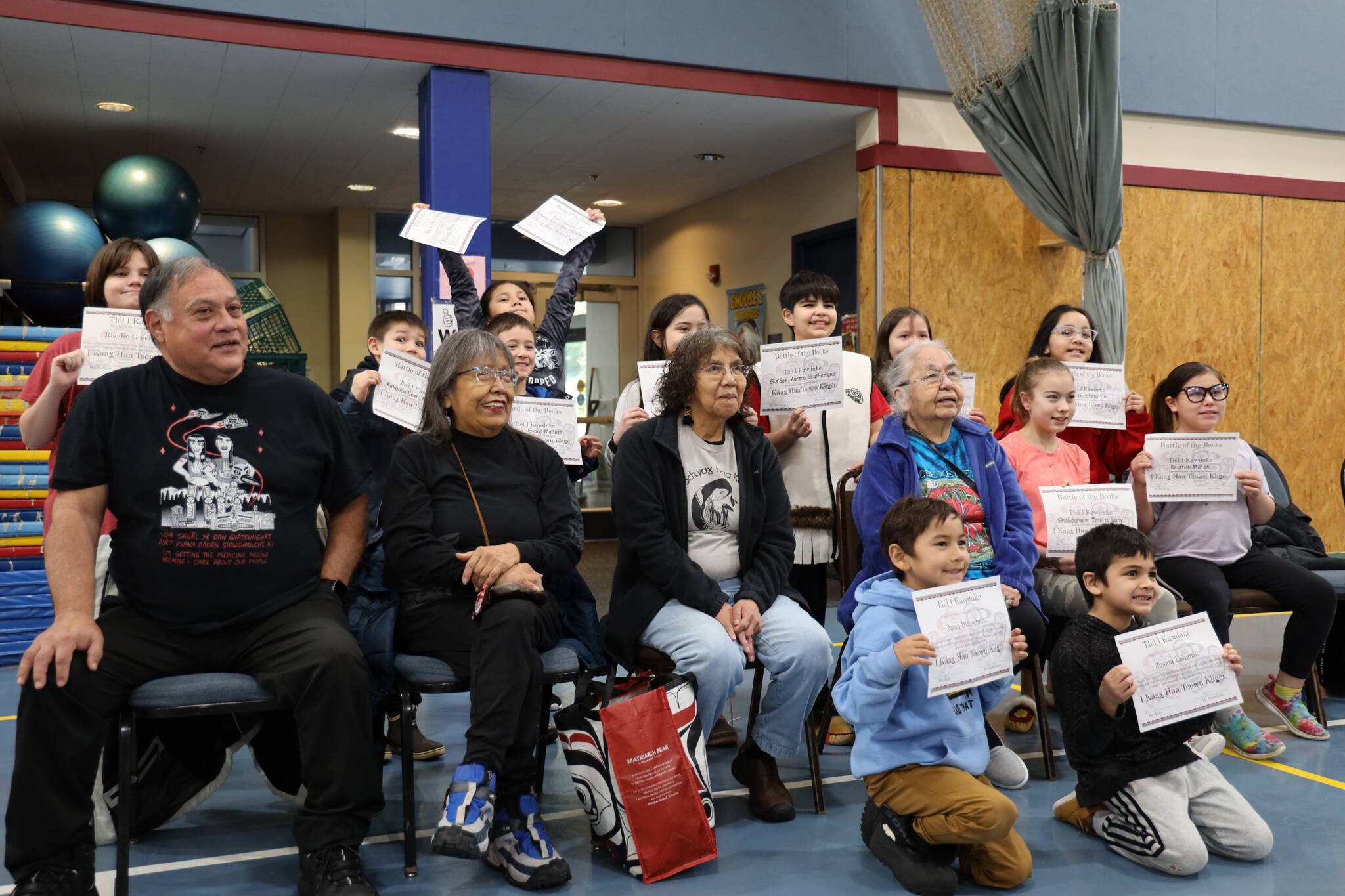 Clarise Larson / Juneau Empire 
Students from the Tlingit Culture Language and Literacy program at Harborview Elementary School pose with awards next to the program’s elders Monday morning.