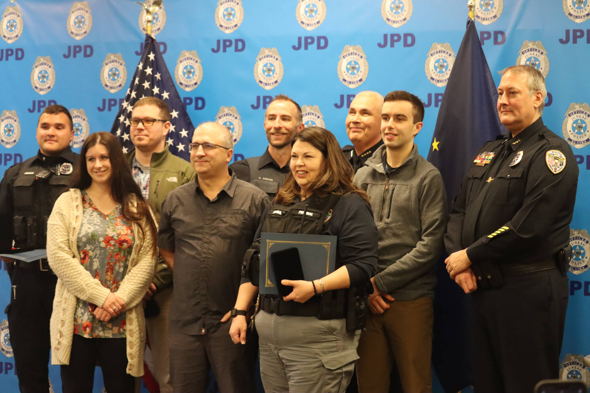 Members of the Juneau Police Department pose for a group photo during the annual JPD awards ceremony on Monday. (Jonson Kuhn / Juneau Empire)