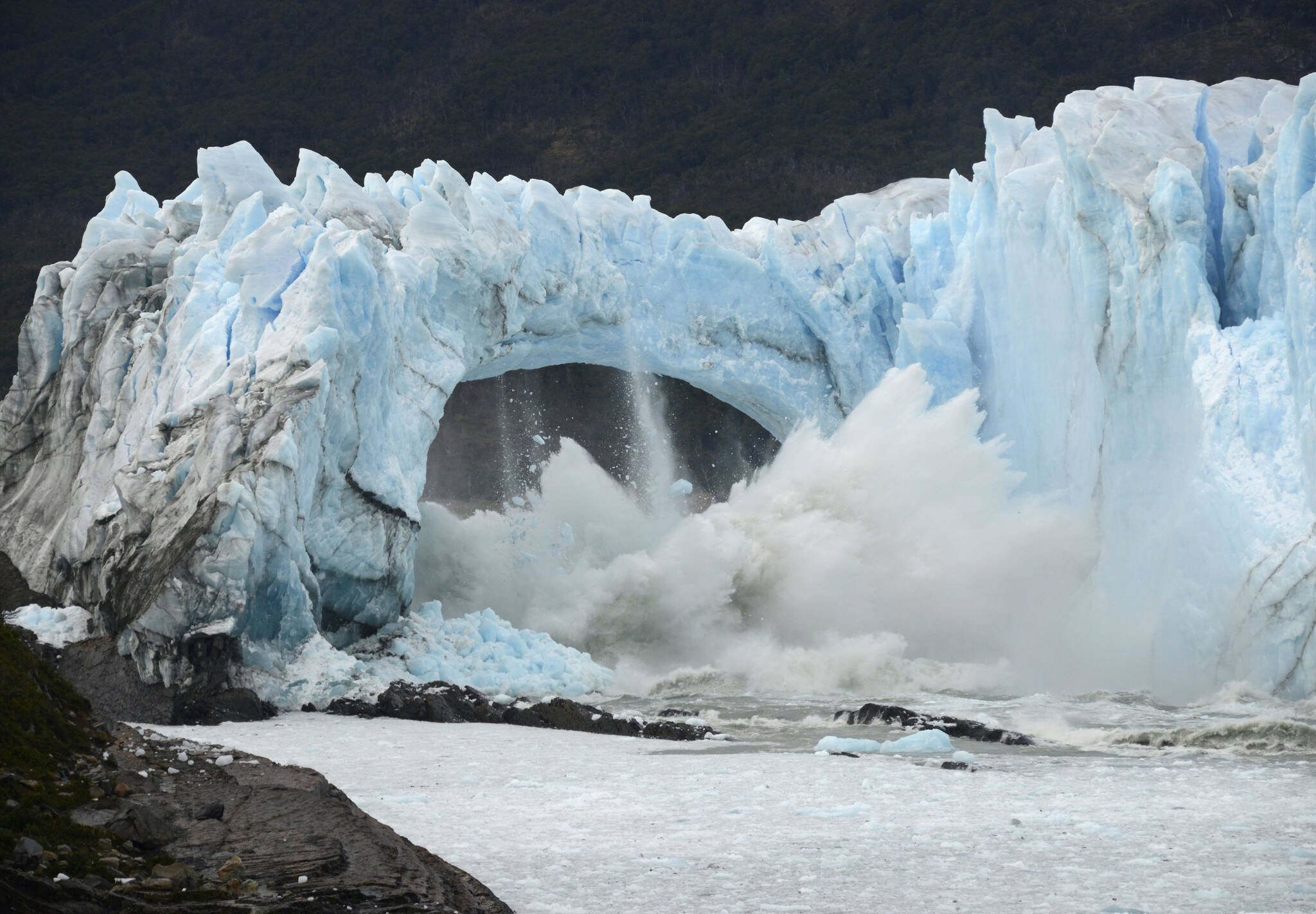Chunks of ice break off the Perito Moreno Glacier, in Lake Argentina, at Los Glaciares National Park, near El Calafate, in Argentina’s Patagonia region, March 10, 2016. As glaciers melt and pour massive amounts of water into nearby lakes, 15 million people across the globe live under the threat of a sudden and deadly outburst flood, a new study finds. (AP Photo / Francisco Munoz)