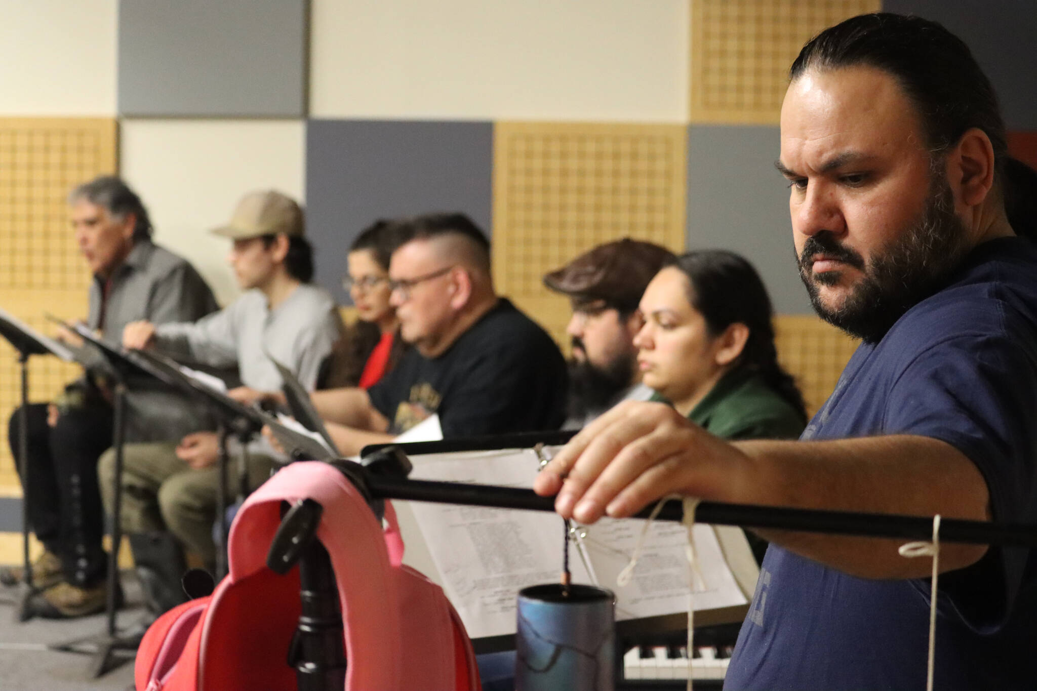 During a Wednesday rehearsal at KTOO studios for the Alaska Theater Festival: Radio Plays, Shaakindustoow Ed Littlefield, seen here, is joined by the cast of Vera Starbard’s, “The Beginning of Eagle” which is an adaptation from stories shared by DaaXKu dein Tommy Jimmie. “The Beginning of Eagle” will be performed Saturday live in-person at KTOO studios as well as on-air at KTOO News 104.3 and 91.7, and online at ktoo.org/listen. (Jonson Kuhn / Juneau Empire)