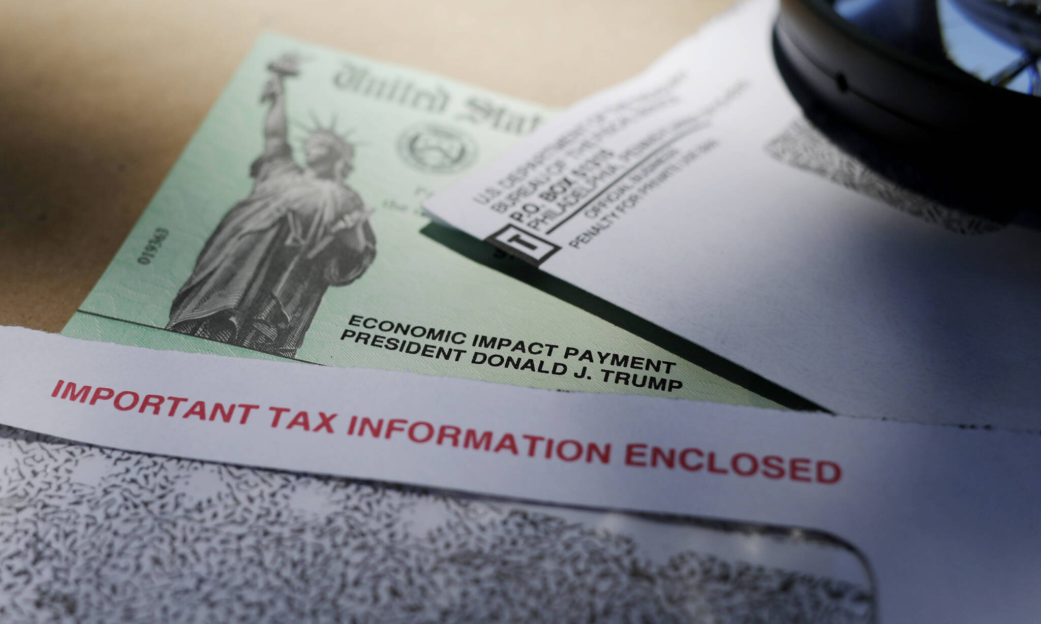 President Donald Trump’s name is seen on a stimulus check issued by the IRS to help combat the adverse economic effects of the COVID-19 outbreak, on April 23, 2020, in San Antonio. The IRS announced Friday. Feb. 10, 2023, that most relief checks issued by states last year aren’t subject to federal taxes, providing 11th hour guidance as tax returns start to pour in. (AP Photo / Eric Gay, File)