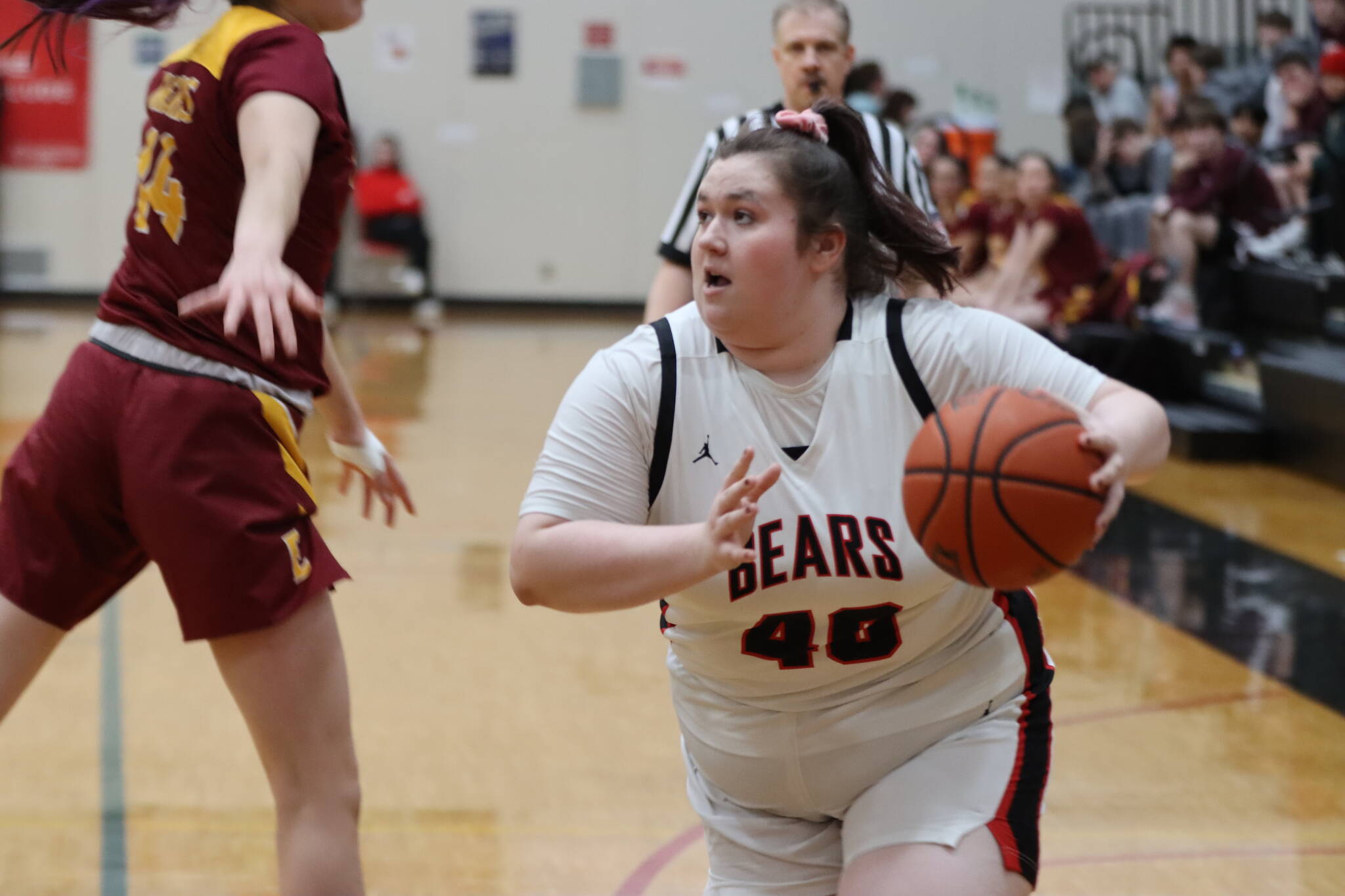 JDHS senior Izzy Waters takes the ball down court on Friday night against Mt. Edgecumbe High School for a non-conference game at home. (Jonson Kuhn / Juneau Empire)