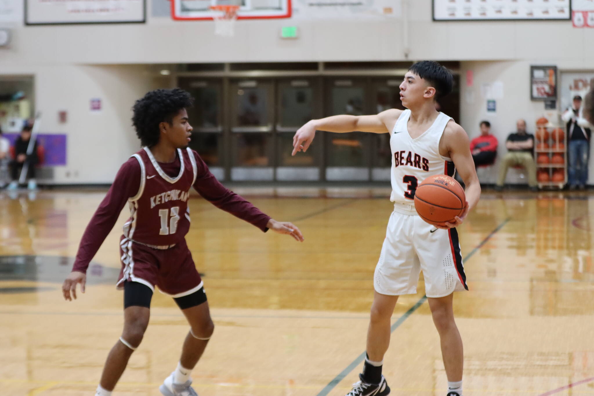 JDHS junior Alwen Carrillo sets up offense during a conference game against Ketchikan High School Friday night at home. Carrillo led his team in scores with a total of 17 points. (Jonson Kuhn / Juneau Empire)