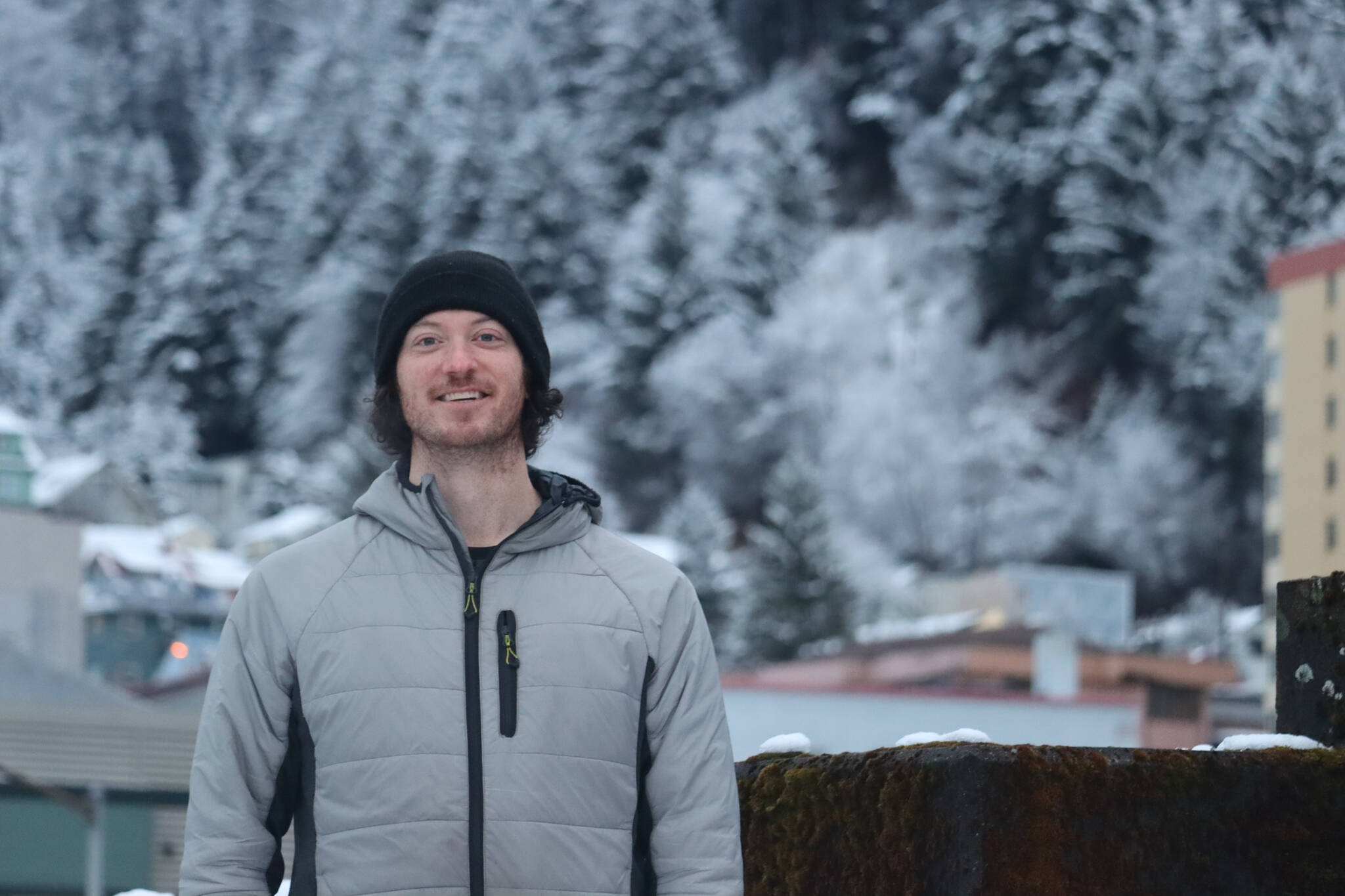 Mark Rainery poses for photo in downtown Juneau to help celebrate the recent showing of his collaborative DIY snowboarding film, “The Outliers,” which premiered at the Hangar Ballroom on Feb. 11. (Jonson Kuhn / Juneau Empire)