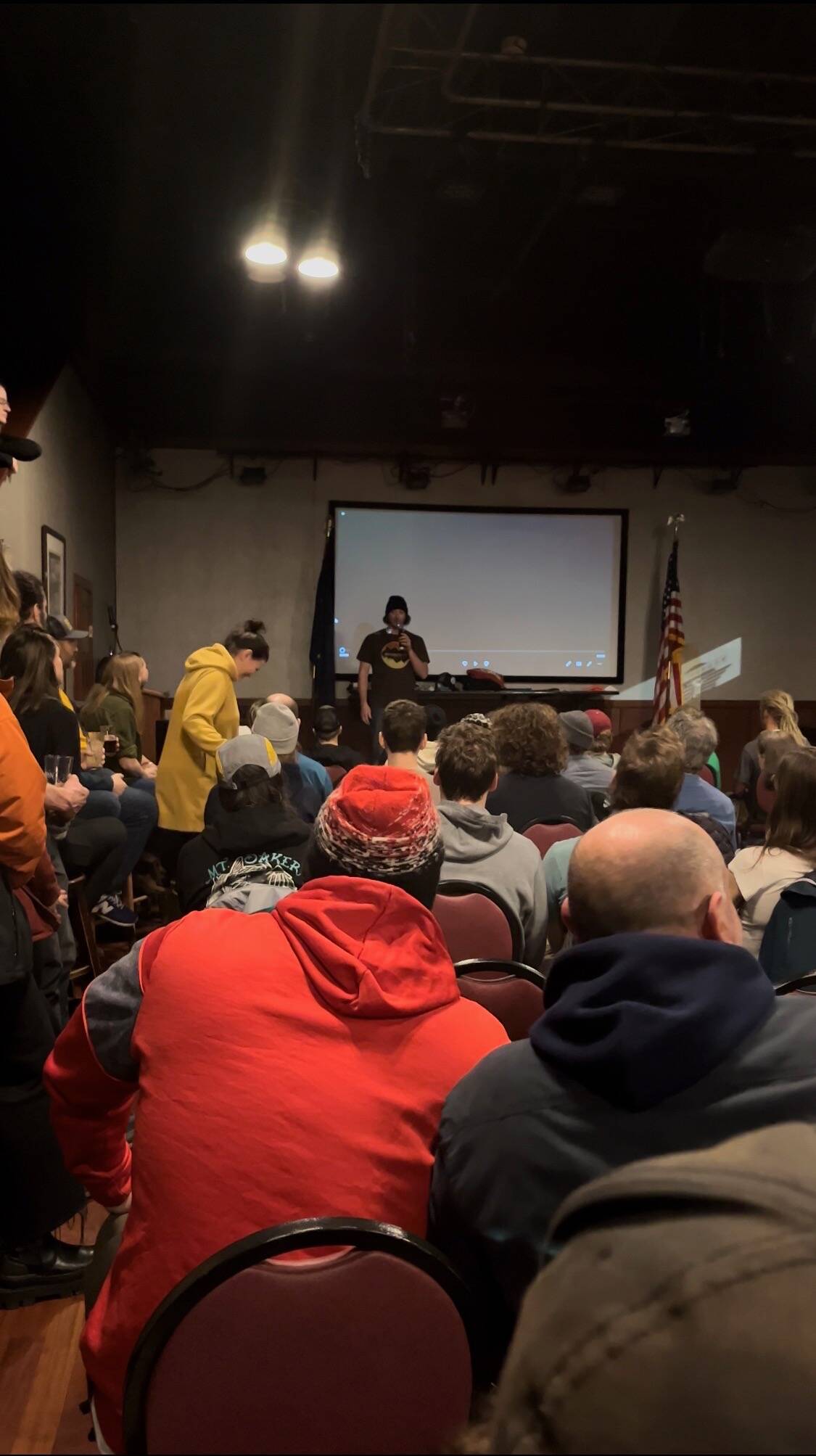 Mark Rainery addresses sold out crowd at the Hangar Ballroom on Feb. 11 for the premiere of his latest collaborative snowboarding film, “The Outliers.” (Courtesy Photo / Kenzie Shultz)