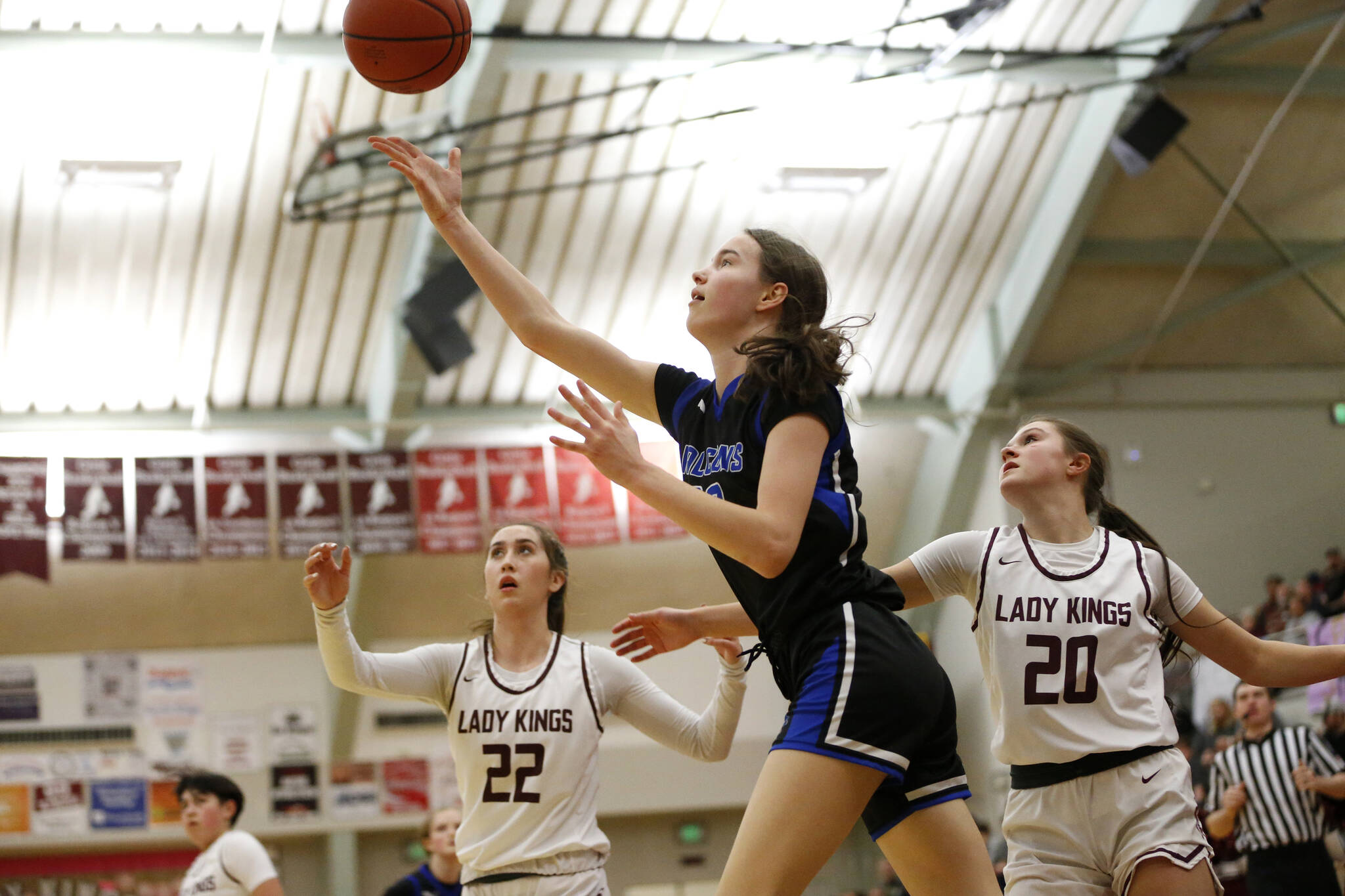 Thunder Mountain’s Cailynn Baxter (23) attempts a layup during Saturday’s game at Ketchikan High School, which Thunder Mountain won 60-38. (Christopher Mullen / Ketchikan Daily News)