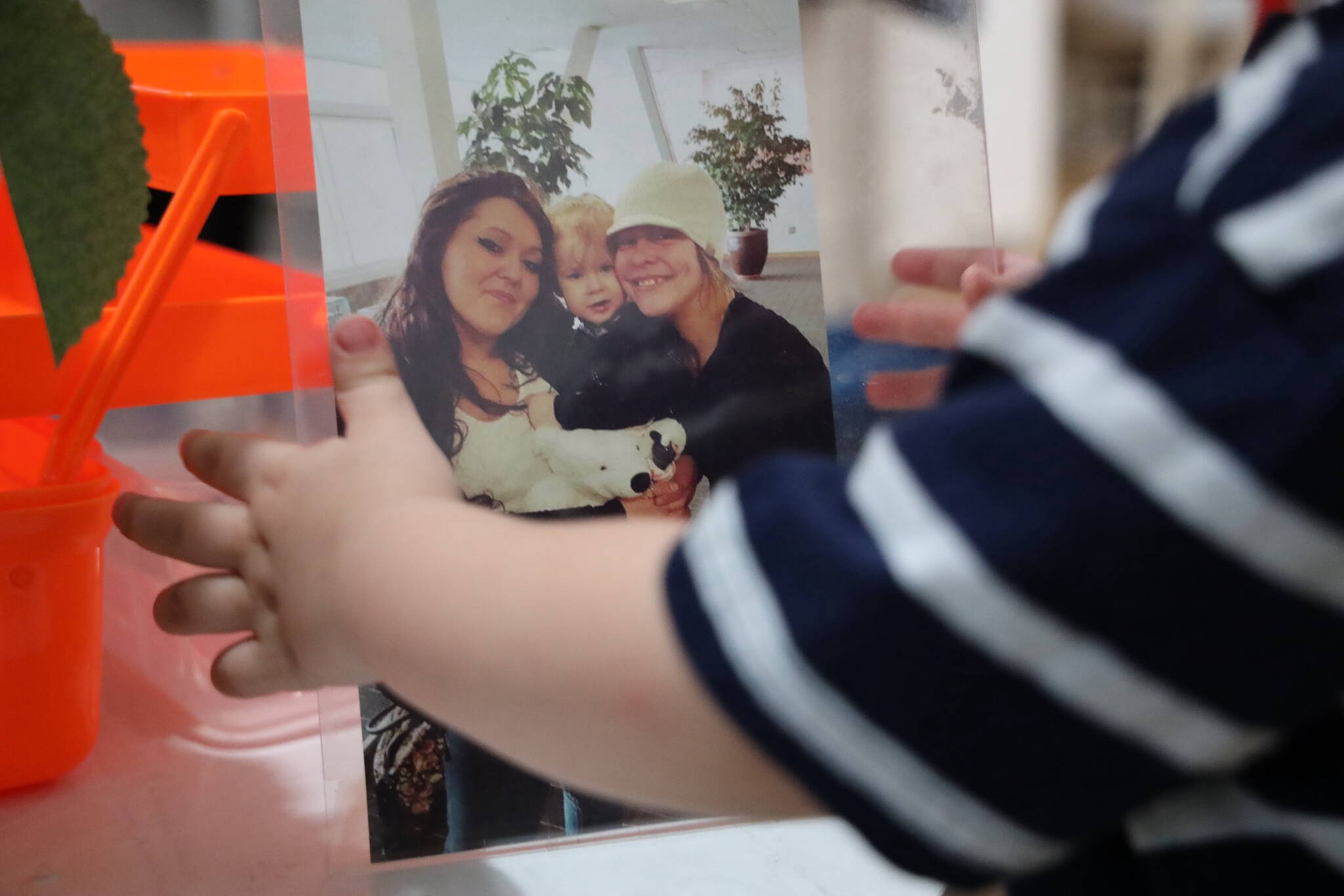 Clarise Larson / Juneau Empire 
Claes Schneider holds a picture of his grandmother, Tracy Lynn Day, right, who has been missing since Feb. 14 2019.