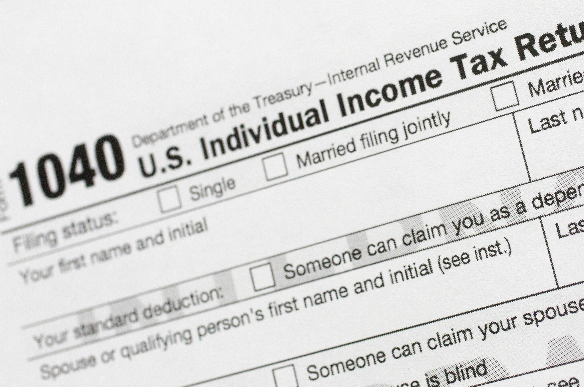 This July 24, 2018, file photo shows a portion of the 1040 U.S. Individual Income Tax Return form. (AP Photo / Mark Lennihan File)