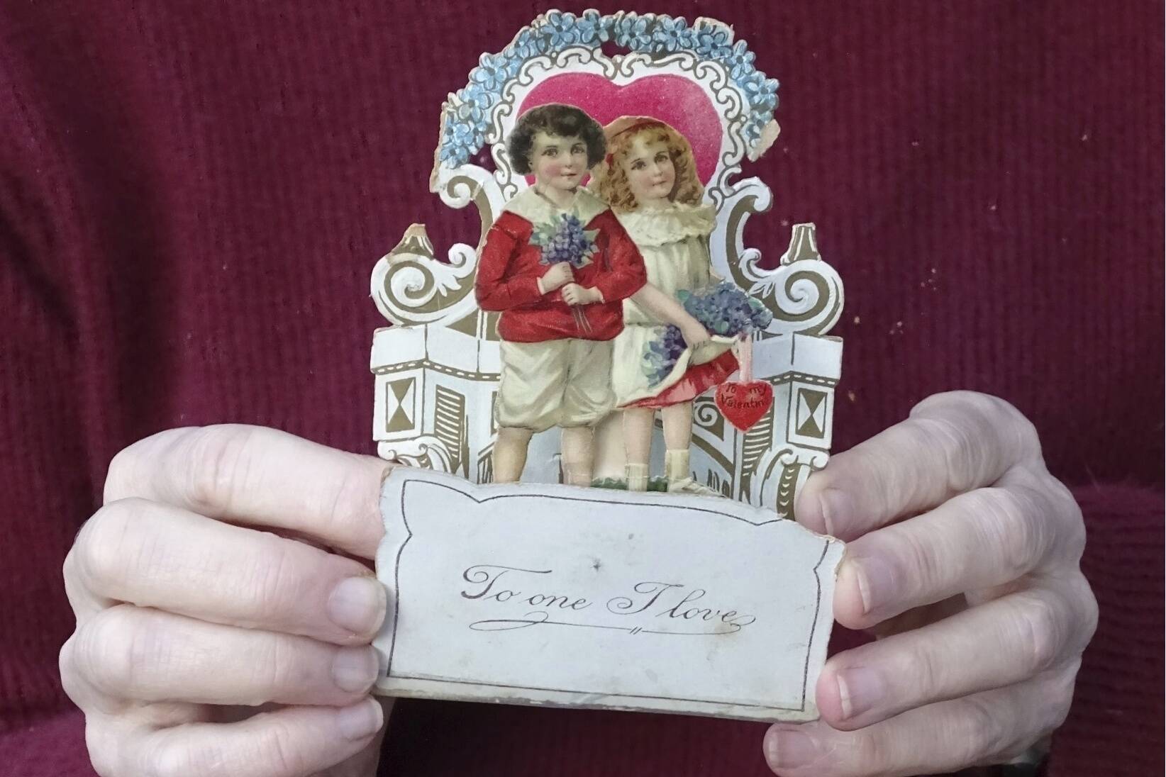 This image shows a Valentine’s Day card from 1917, given to Louise Wirt by Fred Roth when he was in the fourth grade. The couple married years later and the card remained near Louise’s bedside until her death at 91. (Nancy Roth via AP)