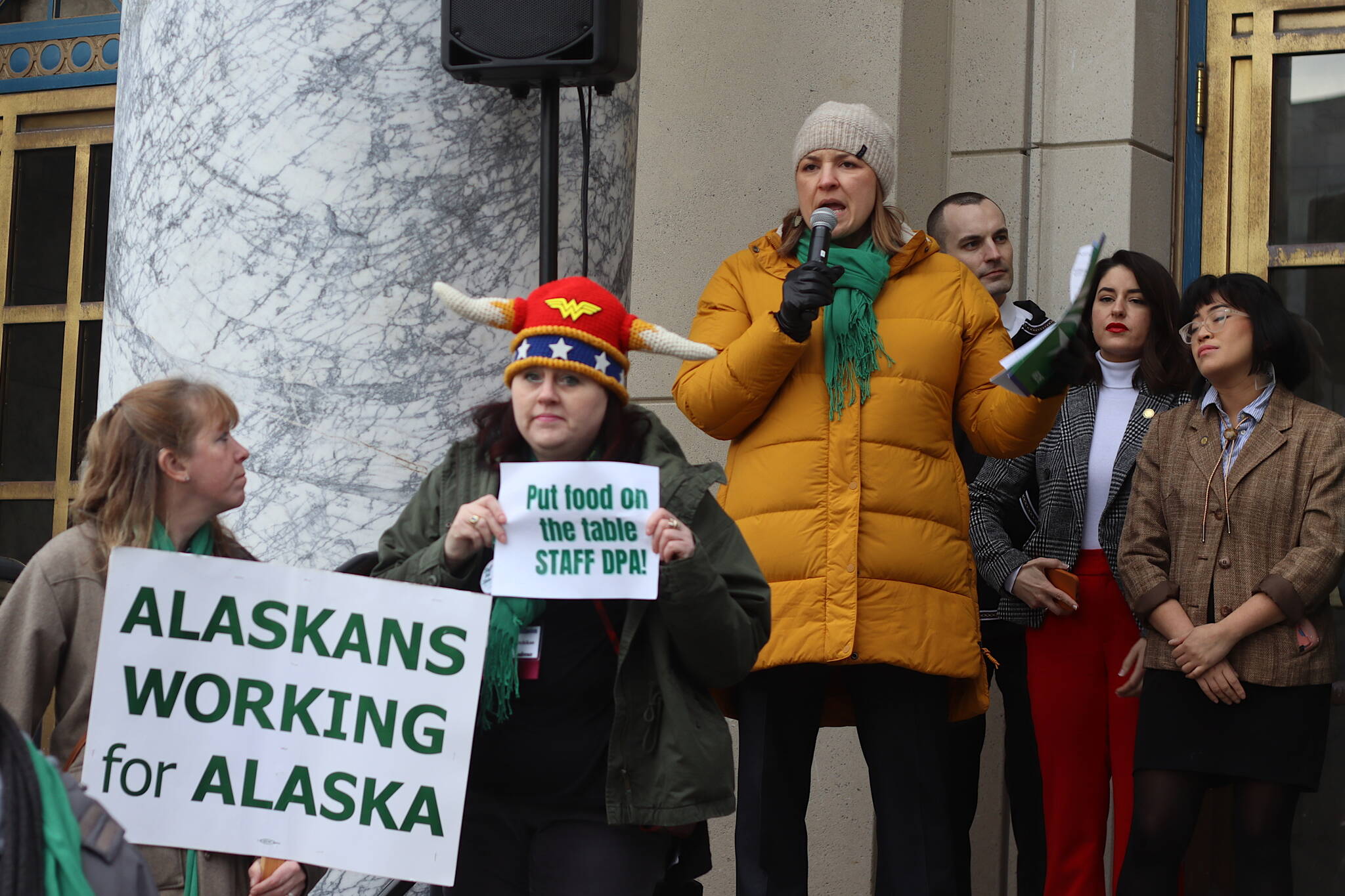 Heidi Drygas, executive director of the 8,000-member Alaska State Employees Association, addresses a rally outside the Alaska State Capitol on Friday where participants protested the workforce shortage facing various agencies including the state Division of Public Assistance. Drygas on Tuesday gave qualified support to an order by Gov. Mike Dunleavy eliminating the four-year degree requirement for most state jobs, stating it is a small part of a big issue involving poor wages, benefits and morale among employees. (Mark Sabbatini / Juneau Empire)