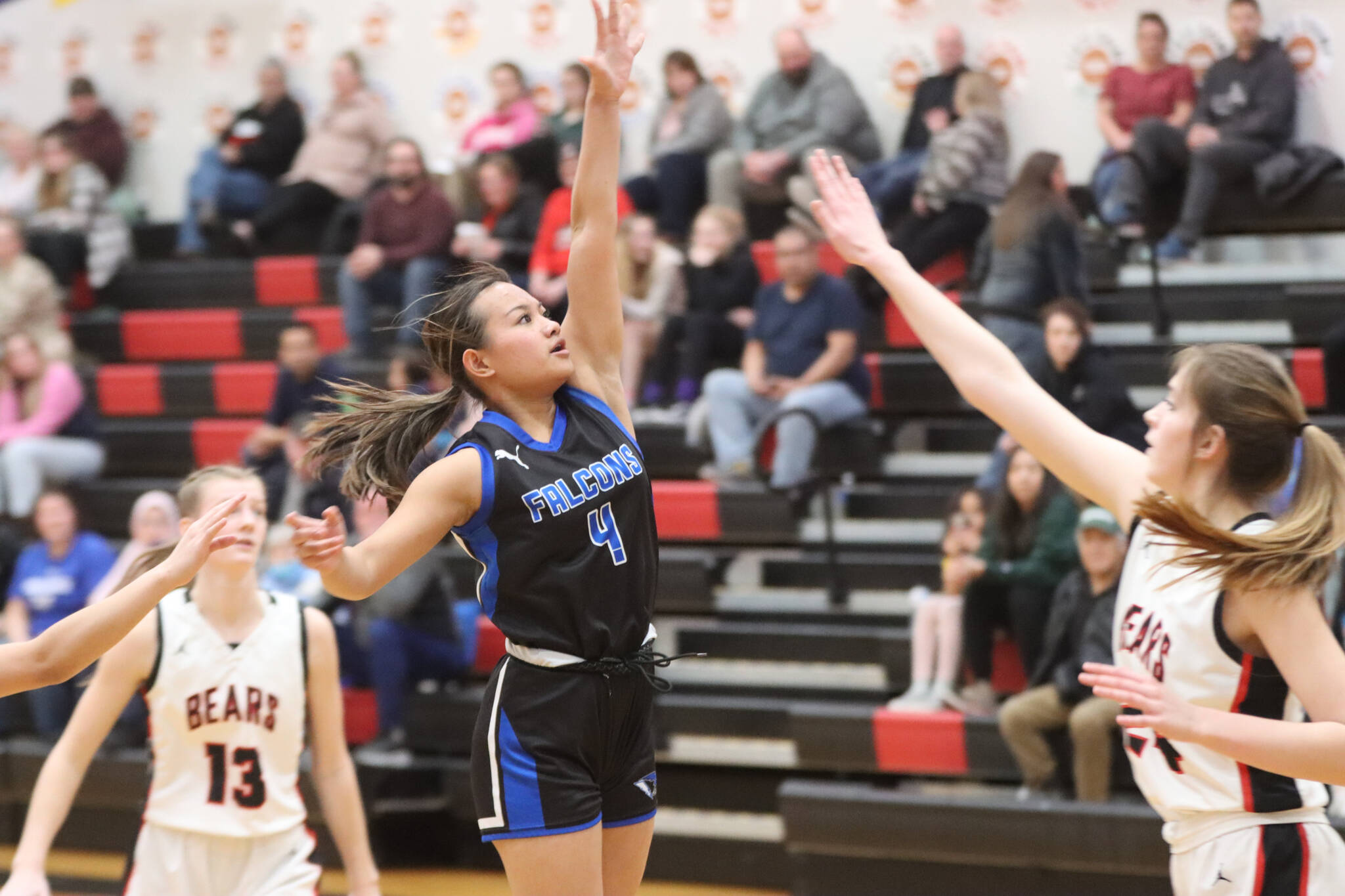 TMHS junior Mikah Caradang puts up a 3-point shot in the second quarter Tuesday night during a conference game against JDHS. Caradang would finish the game with a total of 6 points. (Jonson Kuhn / Juneau Empire)