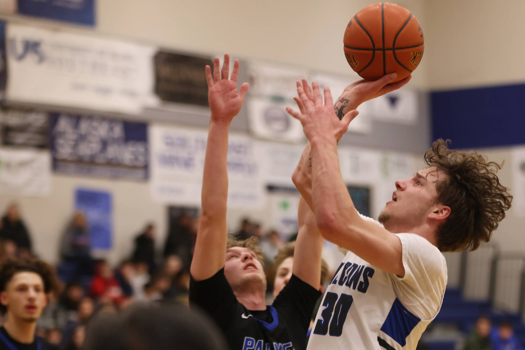 Thomas Baxter puts up a shot against Palmer High School. The TMHS junior finished the game with 22 points. (Ben Hohenstatt / Juneau Empire)