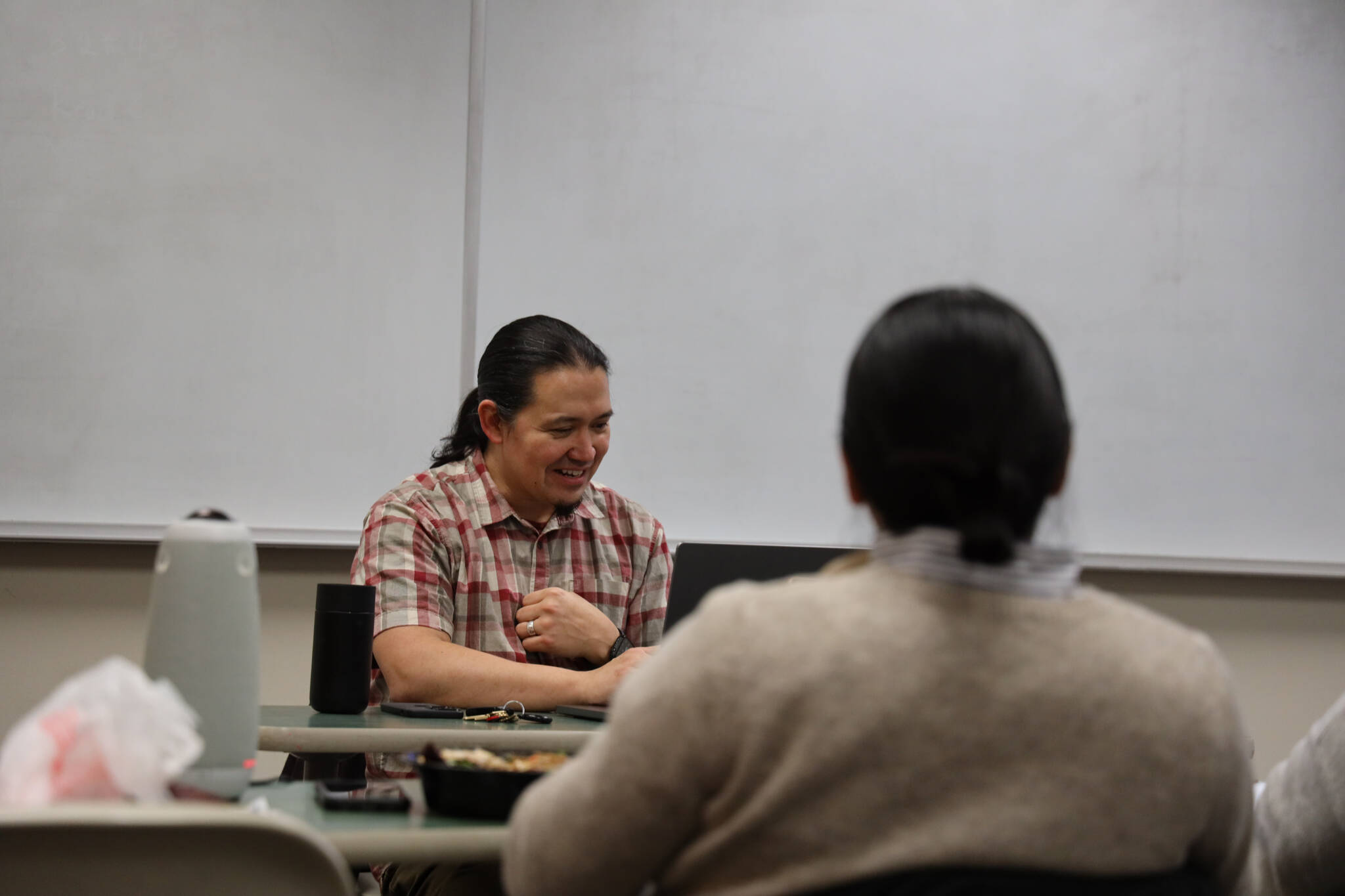 Clarise Larson / Juneau Empire
Professor of Alaska Native languages at the University of Alaska Southeast, X’unei Lance Twitchell, analyses a ChatGPT story in Lingít while teaching his Intermediate Tlingit II class Thursday evening.