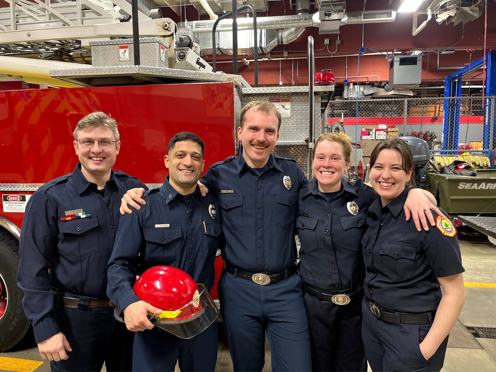 Courtesy Photo / CCFR 
CCFR Captain Cheyenne Sanchez, second from left, poses with friends and colleagues during his Wednesday promotional ceremony at Juneau Station 1.