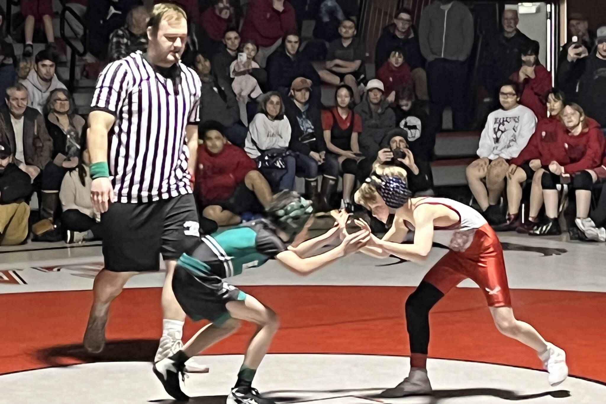 Caleb Scussel from Floyd Dryden Middle School and Luke Bell from Haines Glacier Bears square off against each other for the first of the final matches for this year’s Southeast Alaska Middle School Regional Wrestling Tournament on Saturday at Floyd Dryden Middle School. (Jonson Kuhn / Juneau Empire)